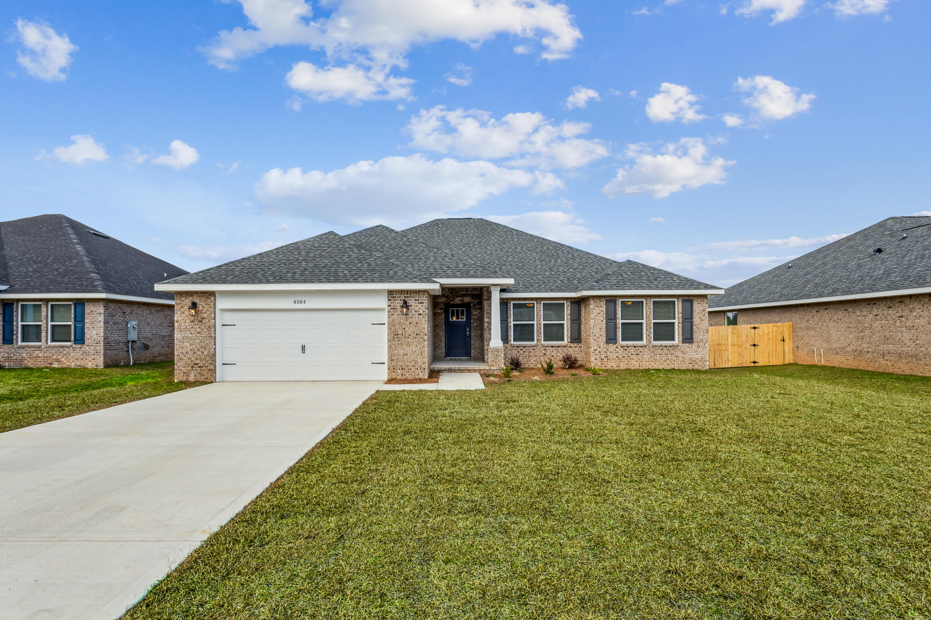 NEW CONSTRUCTION! NO HOA! Backyard Privacy Fence included! Crown Molding included! Blinds included! Discover your dream home in this stunning Liberty floor plan featuring 4 bedrooms and 2 baths. Enjoy an open floor plan with vaulted ceilings and a spacious kitchen complete with an island, stainless steel appliances, ample cabinet space, granite or quartz countertops, and slow-close cabinets and drawers. A separate pantry adds extra convenience. The Liberty floor plan is designed to meet your needs with a versatile fourth bedroom that can be used as an office, playroom, game room, or craft room. The split floor plan ensures privacy, with the master suite offering a serene retreat with a beautiful walk-in tiled shower and a separate garden tub. This home comes with a full backyard privacy fence, perfect for enjoying the .34-acre lot in peace. Crown molding accents the tray ceilings, and installed blinds add extra convenience. Located in a highly desirable new subdivision south of I-10 just off Hwy 87, you'll have easy access to both Navarre and Milton. Plus, you'll be just 20 minutes away from the pristine white sands of Navarre Beach, making coastal living a breeze. Projected completion is November 2024. Photos are of a similar home; colors and selections may vary.