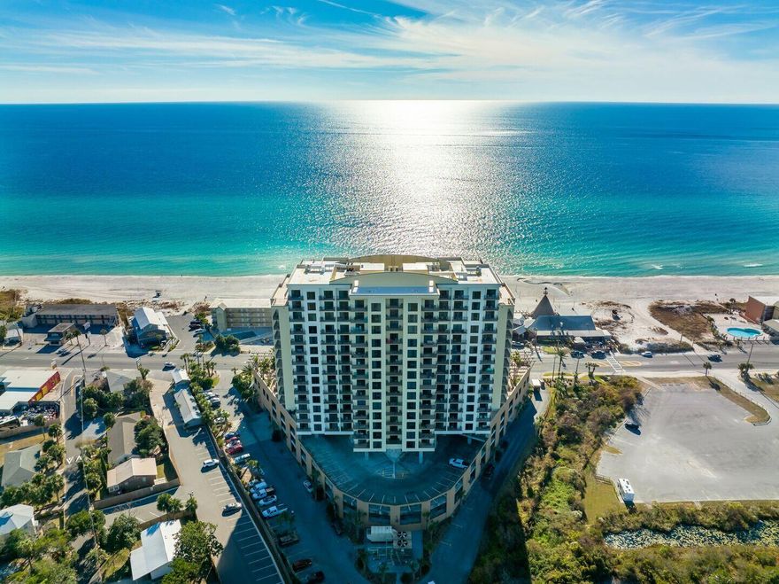 Welcome to Unit 719 - the largest studio floor plan available at Origin at Seahaven! This beautifully updated condo is being offered fully furnished and move-in ready. With no carpet and all ceramic tile throughout, this spacious studio has been thoughtfully renovated with new furniture, beach-inspired decor, fresh paint, and upgraded fixtures. The kitchenette is equipped with a microwave, sink, coffee maker, and both a mini and full-size refrigerator--perfect for a convenient meal in. Ceramic tile flooring runs throughout, and the unit has been tastefully updated with fresh paint, new beach-inspired furnishings, and a tiled tub/shower combo. A king bed and queen sleeper sofa comfortably sleep four, and the spacious layout even allows room to add bunks or a home office setup. The private balcony offers peaceful, north-facing views and extra privacy with solid side walls. Origin at Seahaven combines the comforts of home with the luxury of a resort. Enjoy private beach access to the crystal-clear Gulf waters, plus covered parking and a long list of family-friendly amenities: Grand terrace pool with Gulf views, Hot tub and BBQ picnic areas, fitness center, on-site movie theater & arcade, 24-hour gated security, laundry facilities and vending, on-site retail, walking distance to Sharky's Beachfront Restaurant, Carlos & Charlies, and more. Ideally located directly across from the beach in Panama City Beachnamed by TripAdvisor as home to the ''World's Most Beautiful Beaches''this property is perfect as a personal getaway, full-time residence, or your next short-term rental investment. Whether you're soaking in Gulf views from the rooftop pool, relaxing on the sugar-white sands, or enjoying dining and entertainment just steps from your door, Origin at Seahaven delivers the perfect balance of location, relaxation, and convenience.