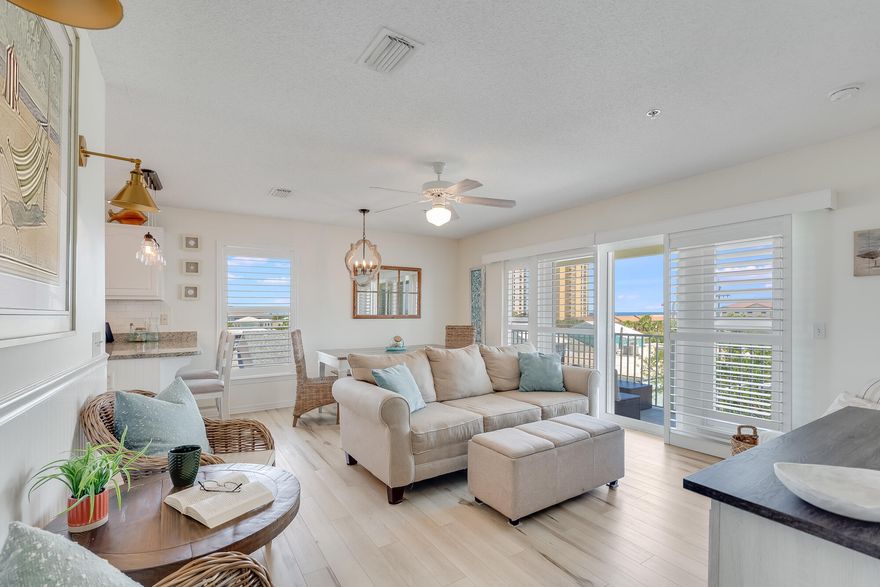 Ocean breezes and iconic sugar white sands await you ~ all while enjoying the balcony views of the Gulf and Navarre Pier from this top floor end unit. This completely furnished condo has fresh and trending finishes with upgraded wide-slat plantation shutters on all windows. A recent renovation included washed-wood look PLV flooring throughout; granite countertops; and high end lighting fixtures; main rooms feature light/combo ceiling fans. Gulf Island Condominiums grounds are meticulously kept and boasts a year round private heated swimming pool for the residents. The main bedroom sits just off the living room with an ensuite bathroom; full bath and shower and private sliding glass doors onto the balcony - allowing you to enjoy cool evening ocean breezes and glorious morning sunrises. The 2nd bedroom and 3rd bedrooms sit off the main hallway; both spacious and have large closet space with shelving. Both access the 2nd bathroom with full bath/shower and vanity.
A laundry room with washer/dryer combo is across from these bedrooms with plenty of hanging space for beach towels and more!
Fall in love with this bright & fresh kitchen, painted white cabinets and marbled granite countertops show off the stainless steel appliances. A separate pantry with full shelving allows for additional storage.
You'll love the privacy of this upper level corner unit; from the views to the easy access of both the gulf beach on one side to the sound beach on the other side. Short walking distance to restaurants, coffee carts and shopping make this an ideal getaway destination. Come see and think about staying awhile ~
