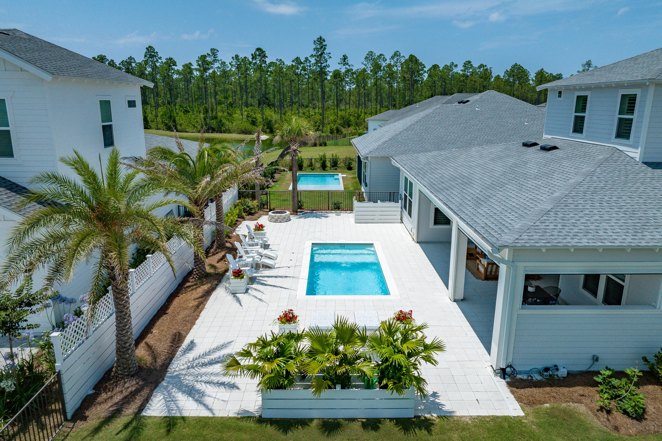 Experience the pinnacle of luxury living at 419 W Lafayette in Naturewalk at Origins, where sophistication meets unparalleled comfort. This soon-to-be-phased-out Venice plan is situated on the largest available homesite, providing extraordinary space and privacy. Families will appreciate the zoning for the highly sought-after Dune Lakes Elementary school. The residence is brimming with custom extras that elevate its charm, from the expansive fenced and gated side yard--complete with a cozy gas fire pit amidst lush landscaping, ideal for intimate gatherings or serene nights under the stars--to the specialty plunge pool with captivating water features and motorized privacy screens on the lanai for ultimate outdoor enjoyment.