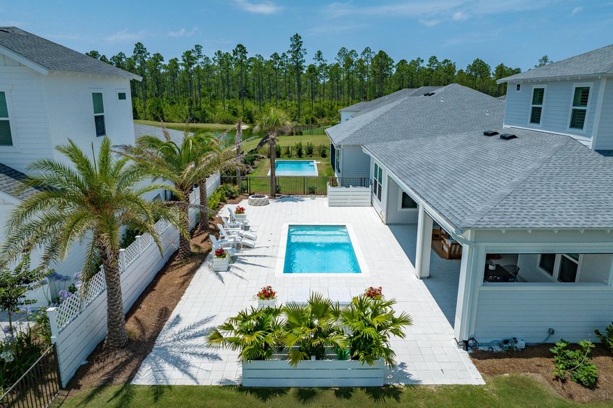 Experience the pinnacle of luxury living at 419 W Lafayette in Naturewalk at Origins, where sophistication meets unparalleled comfort. This soon-to-be-phased-out Venice plan is situated on the largest available homesite, providing extraordinary space and privacy. Families will appreciate the zoning for the highly sought-after Dune Lakes Elementary school. The residence is brimming with custom extras that elevate its charm, from the expansive fenced and gated side yard--complete with a cozy gas fire pit amidst lush landscaping, ideal for intimate gatherings or serene nights under the stars--to the specialty plunge pool with captivating water features and motorized privacy screens on the lanai for ultimate outdoor enjoyment.