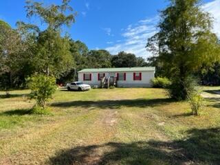 A little piece of country close to everything. 1/2 acre to enjoy your gardening and your chickens. Close to Hurlburt, the beach and shopping centers. Rent your mobile home or live in it while your build your dream home. More photos to come on Monday the 8th. Sold As-Is. Renter is month to month and would like to stay $875 a month.