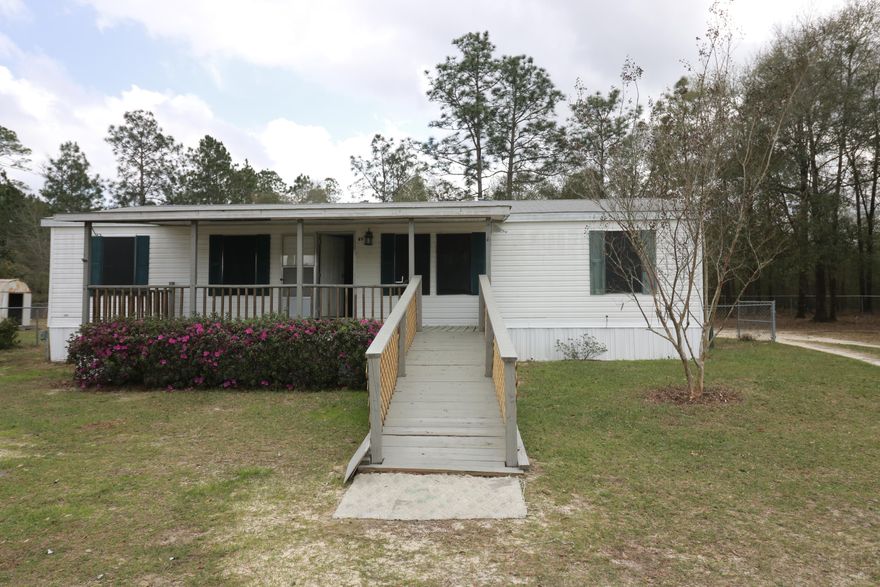 This is a well kept mobile home. It is perfect for either a starter home, rental investment, or for those looking for a quiet get away. Only a short distance from Lake Juniper. The lot is completely fenced. Call today.