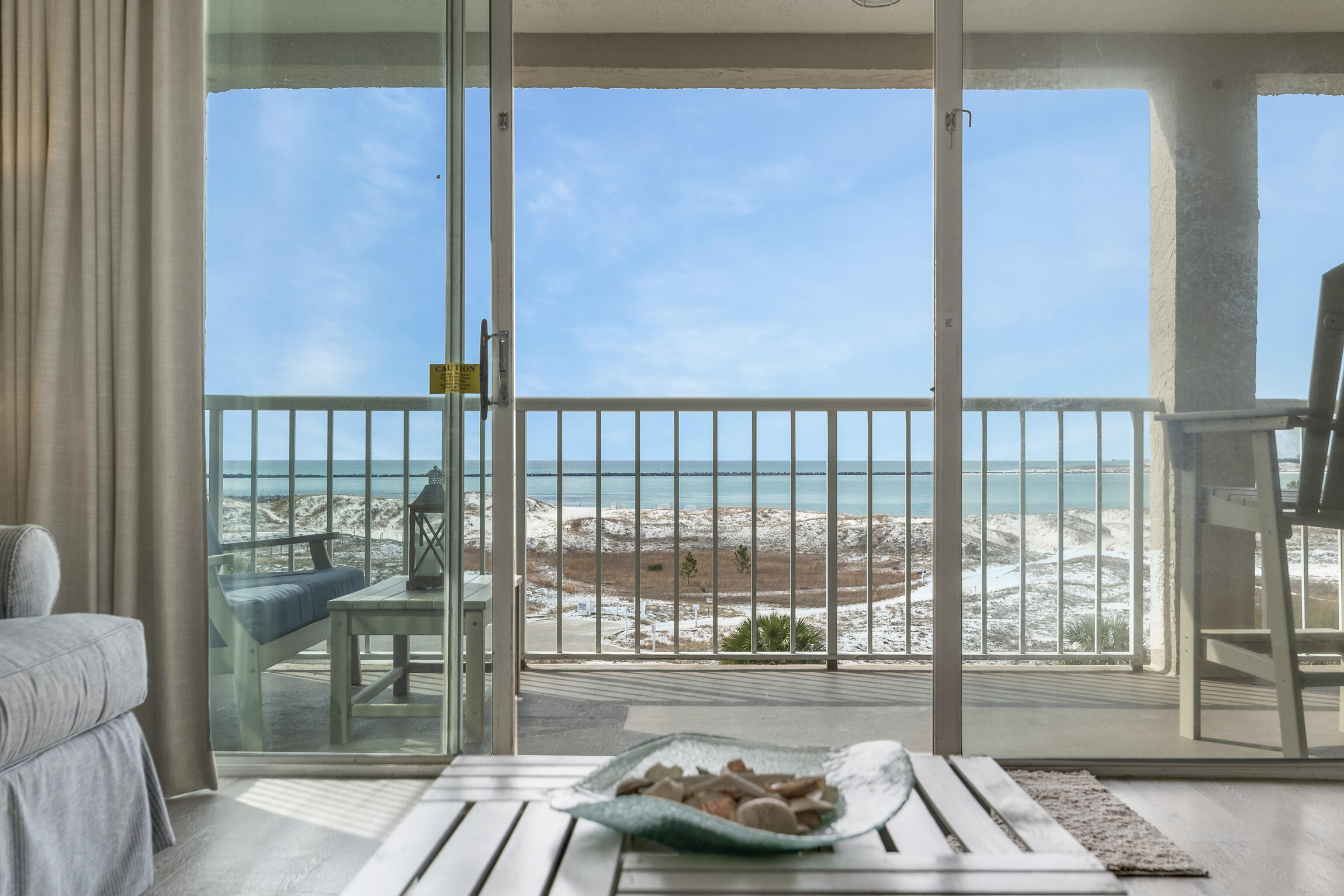 Freshly appointed 4th floor Gulf/Pass Front condo located within the gated island community of Destin Pointe. As the owner of this one bedroom condo, you'll enjoy spectacular views of the Gulf, Destin's East Pass and Crab Island! This condo features tile and LVP floors throughout. The living space is an open concept with the kitchen, dining and living area all enjoying views of the water. The renovated kitchen has quartz counter tops, white appliances and shaker profile cabinets. The bedroom features a king size bed, flat screen TV, & access to a private lanai. Magnolia House is a small condominium located in Destin Pointe, a gated island community featuring tennis courts, shuffle board courts, 2 community pools, more than 3,000 feet of beach frontage, security and great views of the
