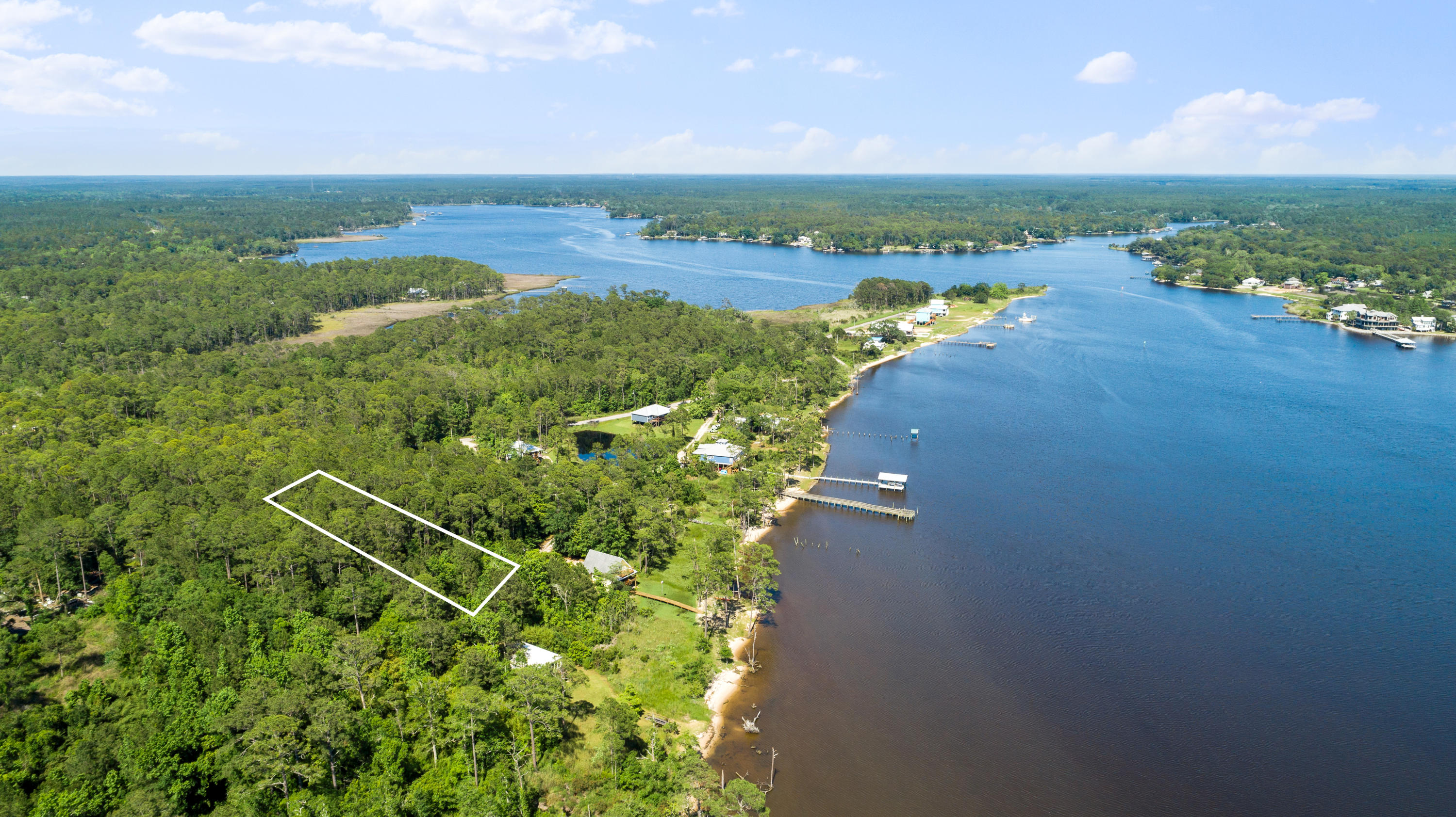 Excellent opportunity to own a great lot just across from the Bay with no build out time. Priced to sell! Select the mature trees & landscape you would like to keep as you build your ideal home on this lot. Questions welcomed.Aerial Photos are idea of where lot location is but not to be taken as exact. All information is believed to be accurate, buyer's to verify.