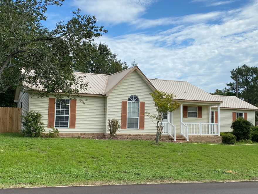 South of the interstate.  Short drive to the military bases.  This 3 bedroom 2 bath with a large bonus room is waiting for you.  Use the bonus room for a family room, game room, or extra bedroom.   Newly painted inside.  Kitchen comes complete with solid surface counter tops, side by side refrigerator, above the stove microwave, and dishwasher.  Large corner lot, screened Florida room, and 2 workshops.  Use one for storage and the other a man cave.