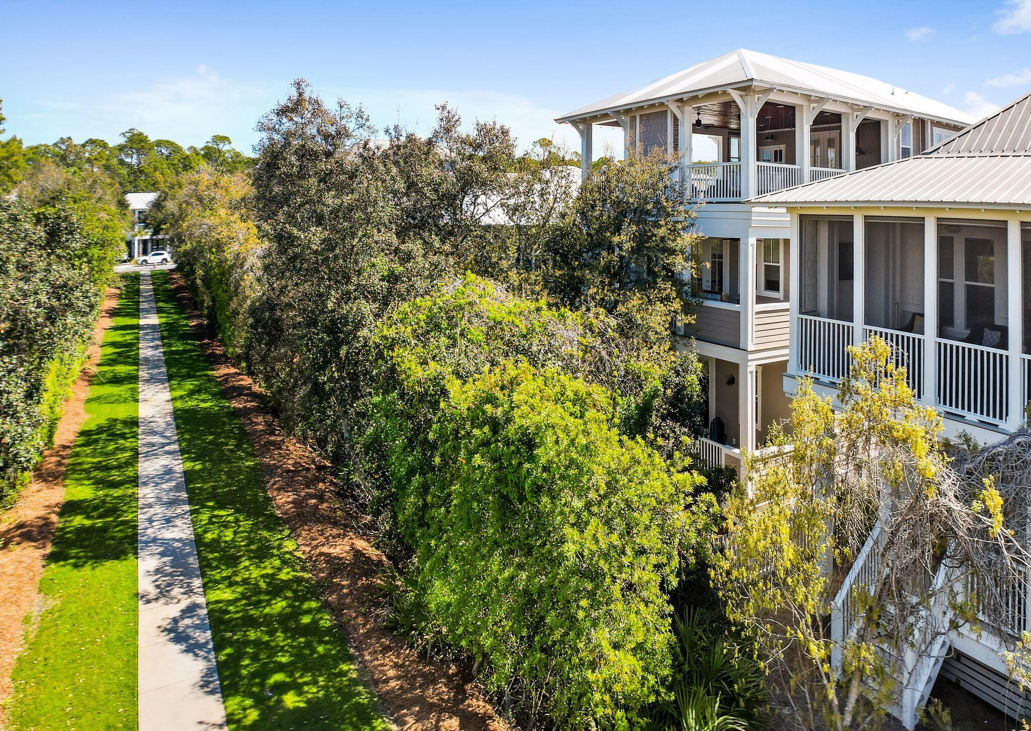 Never Rented! The Beachcomber is a meticulously maintained beach house with many upgrades. Four large bedrooms and a bonus room. TWO MASTER SUITES. Every bedroom has its own private balcony. Lifeproof flooring throughout the house for easy maintenance. The wood decks and railing have been upgraded with Trex decking to make sure you never need to repair or paint. Bahama hurricane shutters add to the aesthetics and protection. The home backs up to a nature trail just a short walk from a large resort pool and recreation area. DEEDED BEACH ACCESS! The bonus room can be a fifth bedroom and is equipped with built-ins, refrigerator and sink. A large top floor deck (also Trex) is ready for many beautiful 30a sunsets.