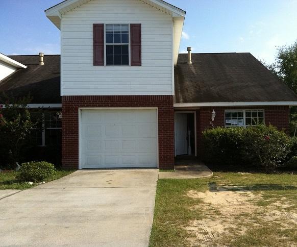 This 3 bedroom/2.5 bathroom all-brick townhome is move-in ready. The walls have been freshly painted in neutral tones. New carpets have been installed upstairs while the entire bottom floor boasts low-maintenance tile flooring. The living room offers soaring vaulted ceilings and an architectural arch above the fireplace with tile surround. The galley-style kitchen has brand-new countertops and all appliances including a stove, dishwasher, and refrigerator. The three bedrooms are all generously sized. The location is very convenient with easy access to both Highway 85 and Highway 90. Walker Elementary is right around the corner and the post office, library, and new Marquis 10 Theater are just a short drive away.