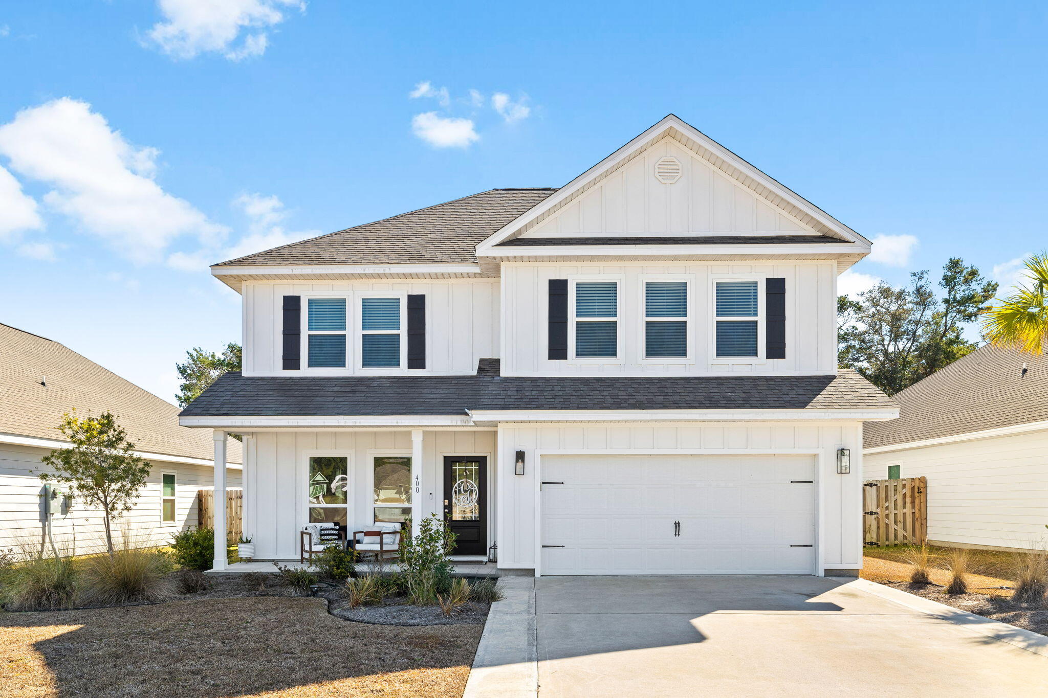 Located in The Preserve at Paradise Cove, 400 JRs Way offers a perfect blend of style, comfort, and functionality. This 4-bedroom, 3.5-bathroom home features 2,487 square feet of thoughtfully designed living space in a sought-after community.Natural light fills the open and airy interior, creating a warm and inviting atmosphere. The main living area flows seamlessly into the dining and kitchen spaces, making it ideal for both everyday living and entertaining. The upgraded kitchen is a standout, featuring a double oven, stylish backsplash, enhanced countertops, and ample workspace for all your culinary needs.The primary suite serves as a peaceful retreat, complete with a custom-built closet system for optimal storage and organization. The additional bedrooms are generously sized and well-appointed. Two of the bedrooms share a Jack and Jill bathroom, offering convenience and privacy, while the fourth bedroom is located near a hall bathroom upstairs, making it perfect for guests or a dedicated home office.
Outside, the private backyard offers endless potential, with plenty of space for a pool, outdoor entertaining, or simply enjoying the Florida sunshine. Whether hosting a gathering or unwinding in the fresh air, this space is ready to be customized to fit your lifestyle.
Located just minutes from the best of 30A and the Emerald Coast, this home is move-in ready and perfectly positioned for coastal living.