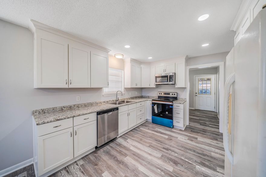 Brick home, metal roof, large lot, completely remodeled inside and no HOA!  This is a must see home in the desirable neighborhood of Forest Hills.  Move in ready; featuring new floors, newly painted throughout, new stainless stove, microwave and dishwasher, new cabinets and countertops, all new baths, new fixtures, new canned lights, and more!  New HVAC in the last 5 years.  This brick homes offers 3 bedrooms, 2 and half baths, family room, dining area, and a huge bonus room that would be perfect for a formal living room, bonus room, office, or whatever your family desires.  Step out back to a covered patio, a large backyard, shed and workshop area, as well another covered area for parking, projects, storage and more.  Double gate for boat or RV. Call today!