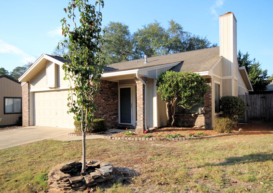 Living in this all brick and wood home is a breeze. The fenced yard is beautifully landscaped with little grass which requires very little maintenance and loads of enjoyment from the outside deck or in the comfort of the finished Florida room with low E glass windows. The front entrance opens into the large great room with vaulted ceilings and a fireplace. The open floor plan then leads into the gourmet kitchen with up-dated stainless steel appliances, custom cabinets, granite counter tops and a large granite island. The home is full of natural light from the many windows, which offer a lovely view of the outdoor landscaping. The hall bathroom has been updated with a handicap accessible walk in tub. The master bedroom is spacious with a walk in closet and a cultured marble master bath.