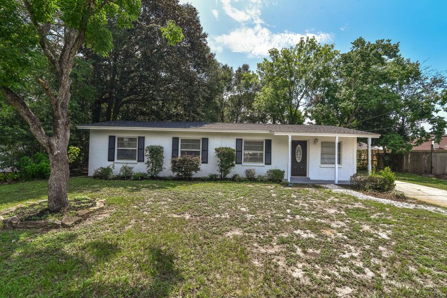 FOUR BEDROOM HOME WITH NEW ROOF AND LARGE YARDThis ranch-style home has tile flooring, new ceilings fans and fresh paint throughout. Step inside to the living area, with the kitchen and dining room just behind. The galley kitchen has been outfitted with all new stainless steel appliances. A breakfast nook at the end makes a great space for a homework station, a family command center, or a bar--coffee or otherwise! A pass-through and walk-through both open up to the formal dining room, where glass french doors lead to the backyard. Nature lovers will adore the extra large backyard with detached shed, in-ground sprinkler system, mature landscaping, and wooden deck.