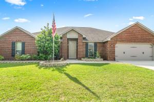 Loaded with many upgrades, this beautiful five bedroom, three bath house in the neighborhood of Kaitlyn's Preserve in the southernmost end of Crestview is a must see! This is a large nearly 1/4 acre lot. This five bedroom, three bath house has durable porcelain tile in wet areas and carpeting in the bedrooms. Walking into the living room one will notice the tray ceiling and elegant recessed lighting. Opening up into the kitchen one will notice the large permanent island with an electrical outlet and stainless steel appliances. The master bathroom has a large walk-in closet.