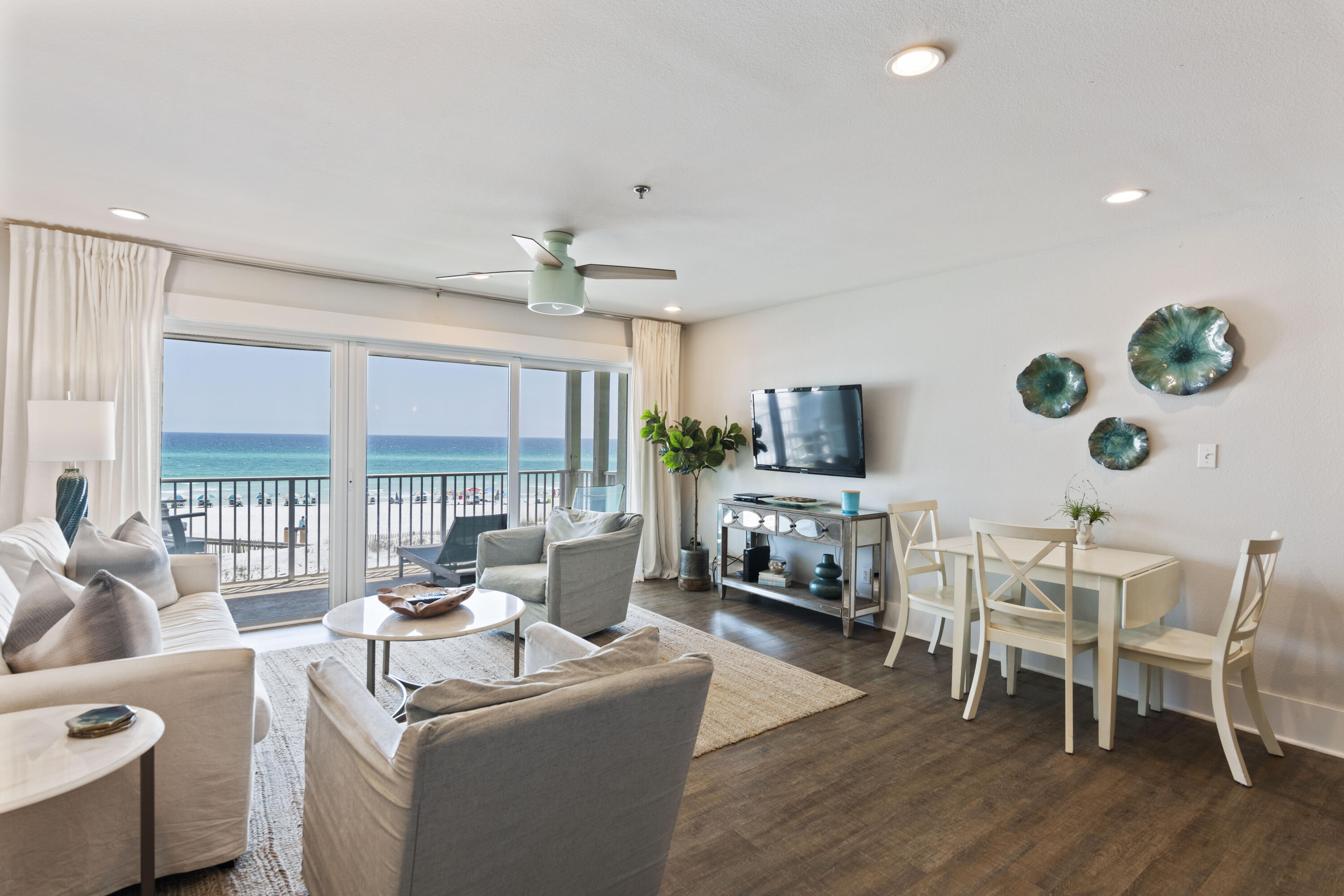 Gorgeous totally renovated condo with expansive views of the Gulf and Eastern Lake outflow. This second floor gulf front condo (with elevator) offers a one of a kind location tucked away in Seagrove Beach. The unit has been completely renovated and professionally decorated in a comfortable coastal chic style. The layout includes a spacious master bedroom plus built-in bunks in the hall.  The living room, kitchen, and dining area have stunning views of the Gulf with sliding glass door entry to private deck. This condo can sleep up to 6 people with King size bed, twin bunks in hallway, and queen size sleep sofa in living room. Other notable property features include covered parking under building, community pool, grilling area, exterior storage closet, and private secured beach access. This