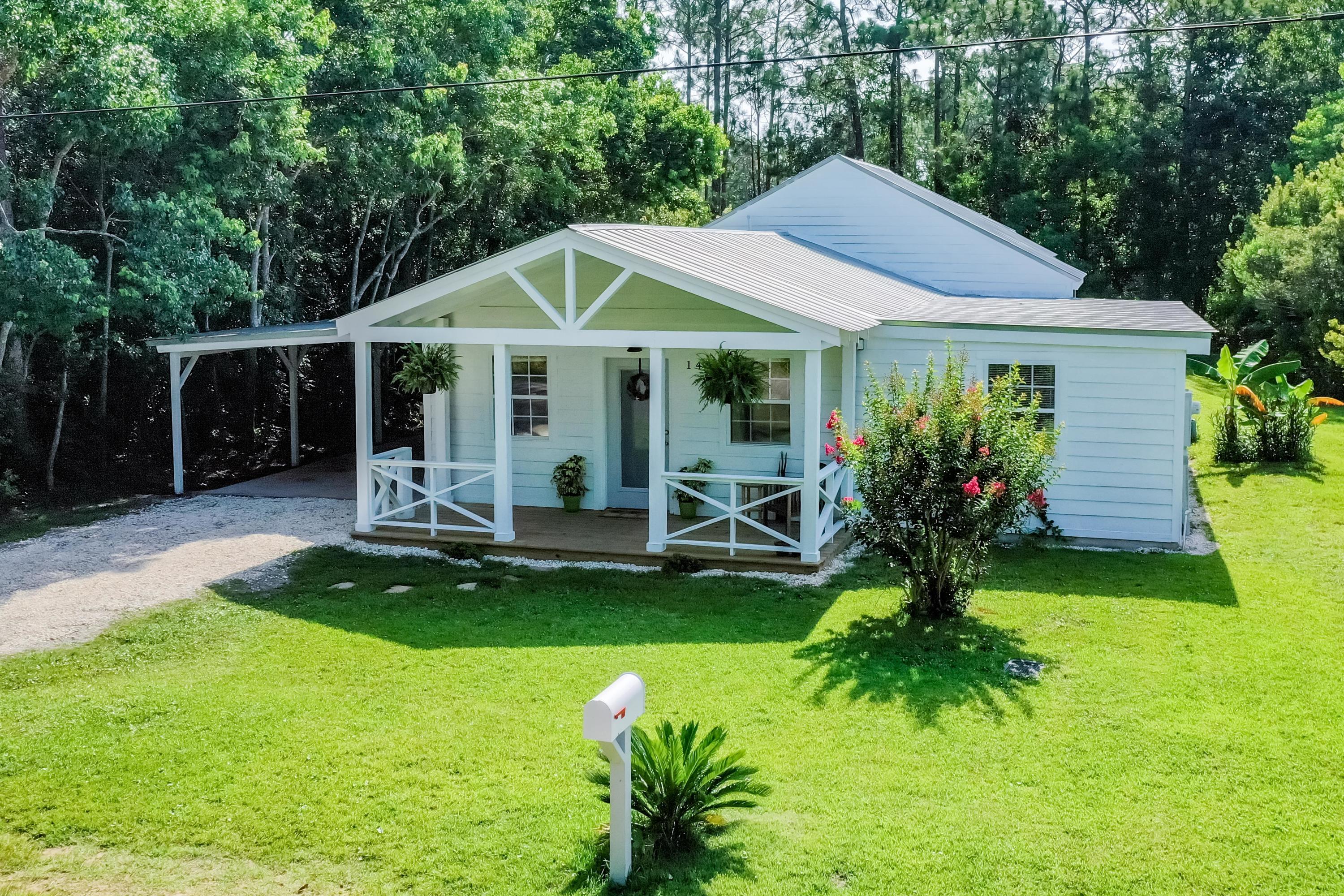 This charming cottage, located in the heart of Santa Rosa Beach, has been completely renovated with many desirable upgrades! Clean landscaping and a generous front porch invite mornings spent sipping coffee or tea, and evenings relaxing with friends and family. Light and airy, this home offers a unique floorplan, complimented by a coastal color pallet that creates an atmosphere made for Florida beach living. Immediately upon entering, you are greeted by a creative, bright, and crisp dining nook and hallway leading to the main living areas. The open concept kitchen features an island with breakfast bar and boasts a long list of upgrades including new cabinets and counter tops, subway tile backsplash, a new farmhouse-style sink and new faucet, and new stainless-steel appliances. The beach