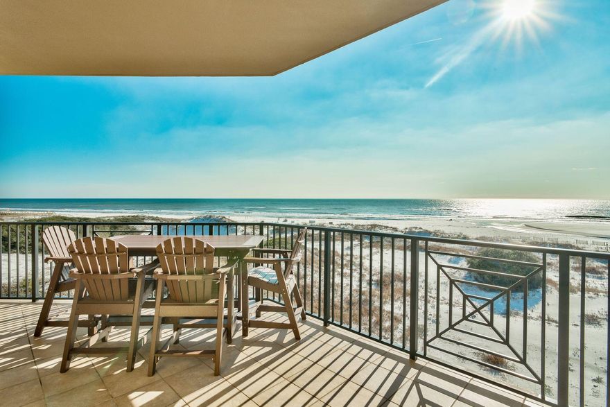 Gaze out across undulating dunes to the sparkling Gulf of Mexico or enjoy uninterrupted lake views from your own private balcony with this luxury condo at Sanctuary by the Sea. 1500 feet of frontage on Big Redfish Lake and 650 feet of beach on the Gulf of Mexico are just some of the priceless features that owners can look forward to. This high-end beach home lives large with a bonus room/office plus a media room currently furnished with three beds. This elegant condo is bright and spacious, from the airy 10-foot ceilings with crown molding to rich travertine floors gracing the living room. Note the corner feature fireplace and the handy wet bar - perfect for mixing sunset cocktails.The well-planned kitchen is generous, with rich granite countertops and a range of cabinets and appliance