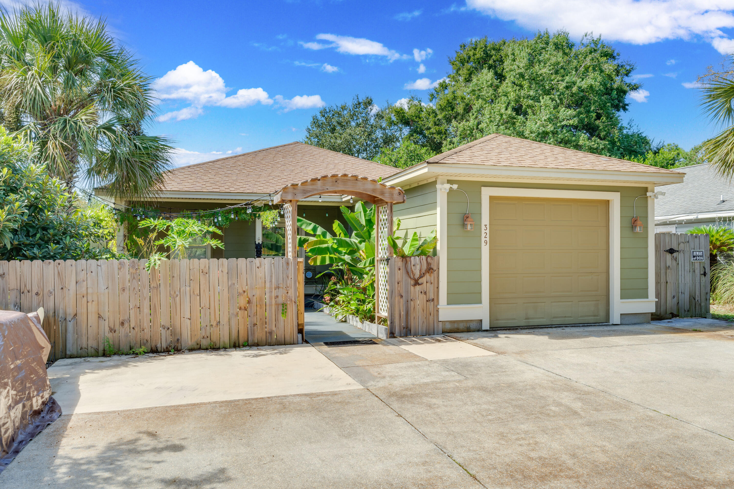 Charming Home in DestinThis Destin home offers an inviting outdoor space with lush landscaping and a private backyard. Inside, you'll find an open floor plan, spacious living areas. The covered patio and fenced yard provide a perfect spot for relaxing or entertaining. Conveniently located near local amenities and the beach.