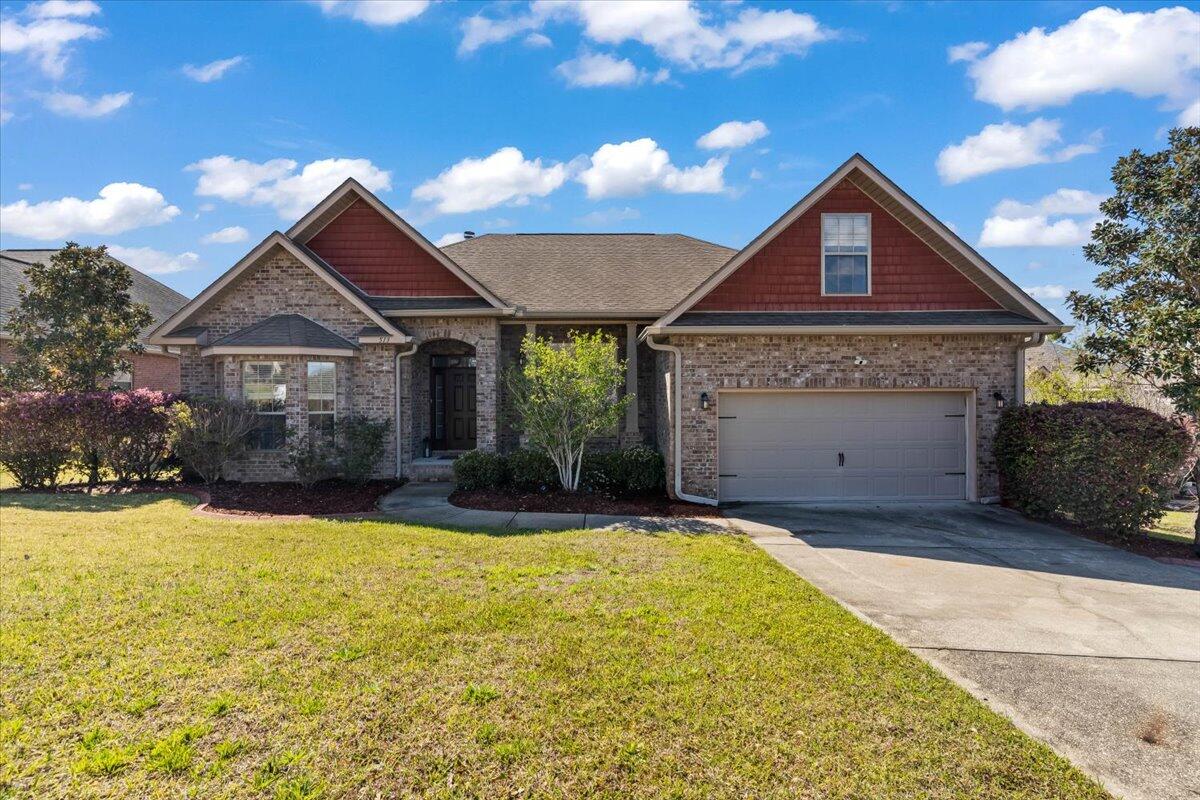 This eye-catching, beautiful home in the very desirable and wonderfully planned subdivision of Fox Valley, is ready for new owners. This home is eligible for an assumable loan at just 5.125% for qualifying buyers. Located just 5 miles from the 7th Special Forces entrance. This home sits towards the back of a quiet cul-de-sac on Pheasant Trail. One of the most popular floor plans, The Cynthia, will delight you with openness, yet plenty of space for privacy. It features 4 bedrooms and 2 bathrooms. Upon entering you're greeted immediately with a wide foyer, to the right a formal dining room, and to the left a flex room that could be used as an office, or with the addition of a wardrobe, a 5th bedroom. The spacious living room with high ceilings is brought together with a fireplace, perfect f or a TV or art work. The living space is big enough to have that huge sectional you have always wanted to be comfortable while enjoying the heart of the home. The kitchen features granite countertops, maple cabinets, staggered molding, with an enormous amount of counter space, and bar top, with an adjacent breakfast area. Just beyond is the awesome master bedroom which is very large and features an ingenious sitting/office area, that also leads to the back deck. A huge master bedroom wouldn't be complete without a large master bathroom, and this home doesn't disappoint. The master bath features a long double vanity with a granite counter, a separate shower with glass door, a wonderful soaking garden tub and frosted glass window, leading to the very big walk-in closet. On the opposite side of the home you'll find the nice sized bedrooms #2 and #3, the guest bath, and laundry room. Upstairs you'll be pleasantly surprised with this 4th bedroom, office, bonus room, or play room. Perfect place to get away and relax. The back of the home features a wonderful screened porch for those beautiful evenings, and just out the porch is the huge wooden deck, for BBQ's, parties, entertaining, or just relaxing outdoors. Down the steps of the deck if the very large yard, with sprinkler system to keep the beautiful landscaping green. Make this home one of your Must See homes.
