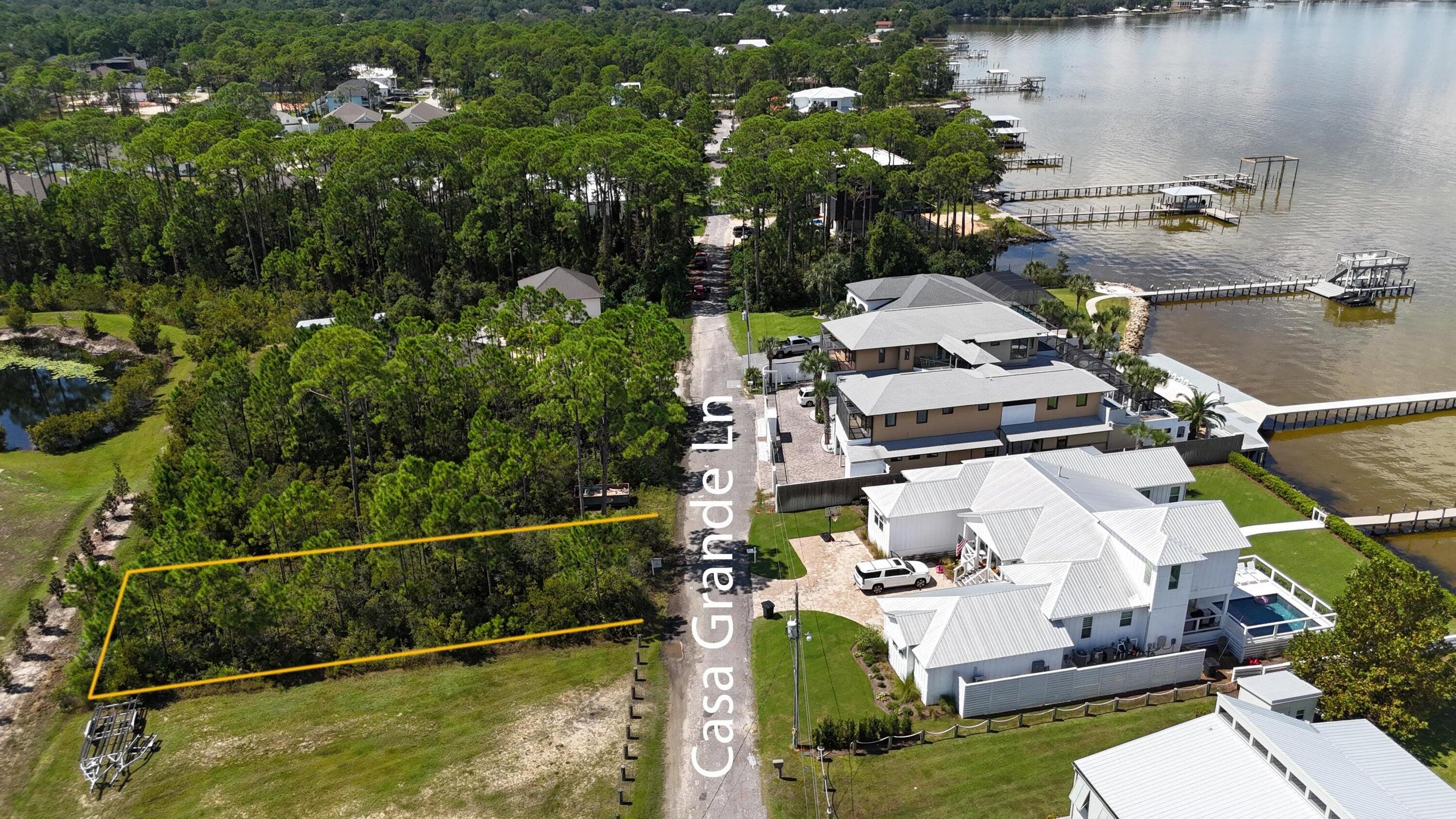 Homesite is part of Treasure Trove Subdivision. An amazing opportunity to own a homesite with recreational Bay access and bay front views at a great price. Build your dream home and wake up to the peaceful serenity living by the water can bring. There are several home plans available that will maximize views of the bay (Front of home faces homes on bay across street). A short walk to the community access on the Choctawahatchee Bay. Minutes to all Santa Rosa Beach and Miramar Beaches.. Only 5 minutes to Grand Blvd and 7 minutes to Scenic 30A! This beautiful water view lot is part of the Treasure Trove Community which gains the ability to use the Community Bay Access. All utilities are already on property. water,sewer & gas. Your dream home location or investment property already found. More details and survey are available from prior owners and planning, HOA Documents are available upon request. Come by in the evenings and check out the Treasure Trove Community bay access while sunsets are beautiful.