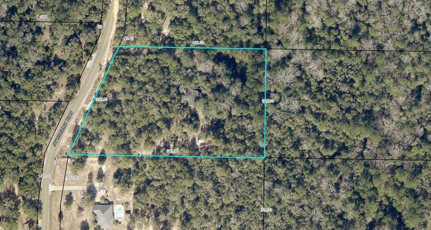 Almost 5 acres just waiting for you to build your dream home. Unique creek running through property coming from natural springs. Will need some cleaning up, an old mobile still resides there that will have to be removed and has no value. There is also a pole barn that has some good bones just needs some TLC. Power already on the property. Price to sell!