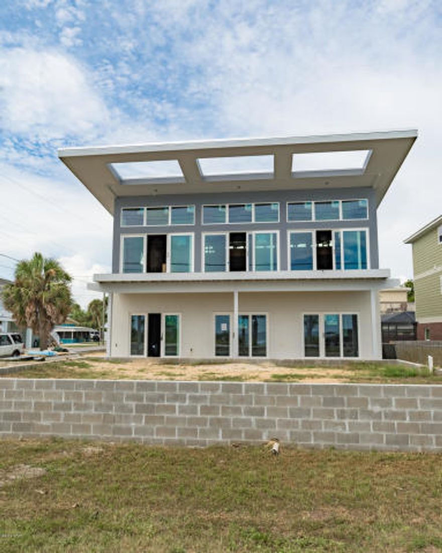 Custom Built BID-A-WEE BEACH BEAUTY! Come and experience this modern home designed and crafted by Boomerang Builders. This home exemplifies innovative and forward engineering skills, spacial brilliance, modern design, functionality all without compromising the high quality and very cool architecture! This is not just a home, it is literally a piece of art! The unobstructed views are seen from the open living/kitchen area through the expansive length of windows which extend across the entire front of the home. 4 bedrooms have their own bath and there are two bonus rooms perfect for bunks.This a dream property for rental, second or primary home. This home is amazing and the location is incredible! It's right across from the sought after, Bid-A-Wee Beach. This is a MUST SEE!