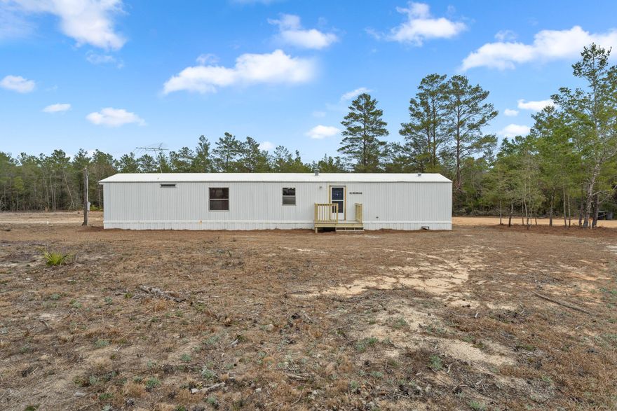 Don't miss this charming home in a country setting. This 2-bedroom 2-bathroom mobile home offers an updated inside on .46 of an acre. There is an open floor plan with living, dinning, and kitchen all flowing nicely throughout the home. Master suite has walk in closet and attaches to the large master bathroom with a walk-in shower. Schedule you're showing today!