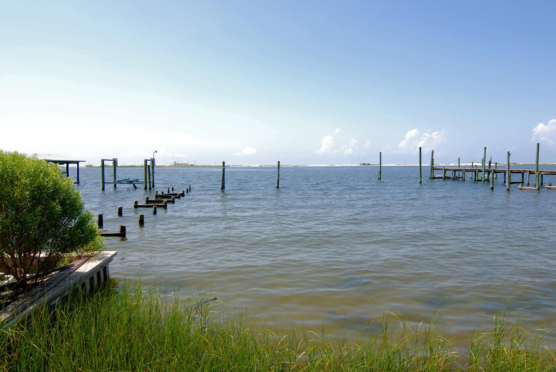 A Diamond in the Rough! This waterfront property is .77 of an acre with 101 feet on the Sound/Intercoastal Waterway. Renovate the existing 4BR/3BA home with 2,332SF of living space or build your dream home on the sound. Quiet & secluded this lot is hidden from the hwy and offers amazing views of the Sound/Intercoastal Waterway, Okaloosa Island (Air Force Land) & Gulf of Mexico. Down at the water, there is a Seawall in place & a dock that was damage, but could easily be repaired/replaced. This property awaits & is ready for new memories to be made by you! This properties is being sold as is.