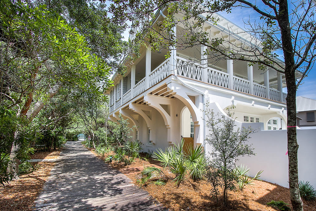 From the moment you approach this Abaco Lane home on the gulf side in Rosemary Beach, you know you have arrived somewhere special. Newly constructed by acclaimed builder Benecki Homes of Atlanta, the character and exceptional quality of the home are readily apparent. Enter the courtyard to be greeted by a tranquil expanse of gleaming white peacock pavers that lead you to a glistening aqua dipping pool. As you enter the residence your senses are further delighted by softly curving Venetian plaster walls and a gracefully arched passage that allows a glimpse of massive, rustic wood beams in the living room. This room is a beautiful, bright space that evokes the feel of the beach, tastefully decorated, as it is throughout, by Melanie Turner Interiors in soft whites like the sand and watery