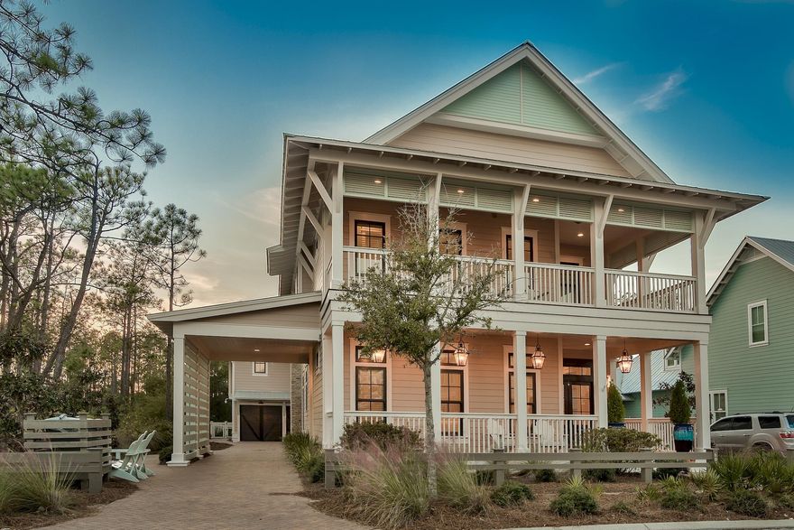 This custom-built WaterColor home offers 4,082 square foot of coastal living with 6 bedrooms and 6.5 bathrooms. *Check out the lifestyle video and virtual tour of this amazing property in the Photos section.* The main house features 4 bedrooms and a drive through porte-cochre leads to the carriage house that features 2 bedrooms. The oversized porch features beautiful Cumaru wood decking, tongue and groove wood ceilings, copper light fixtures and magnificent double mahogany doors. Stunning custom interior details include wide plank Ash wood floors, shiplap walls, custom molding and cabinetry throughout. The first floor offers a free-flowing layout with a combination of transom-topped windows and French doors that bathe the living and dining area with an abundance of natural light.