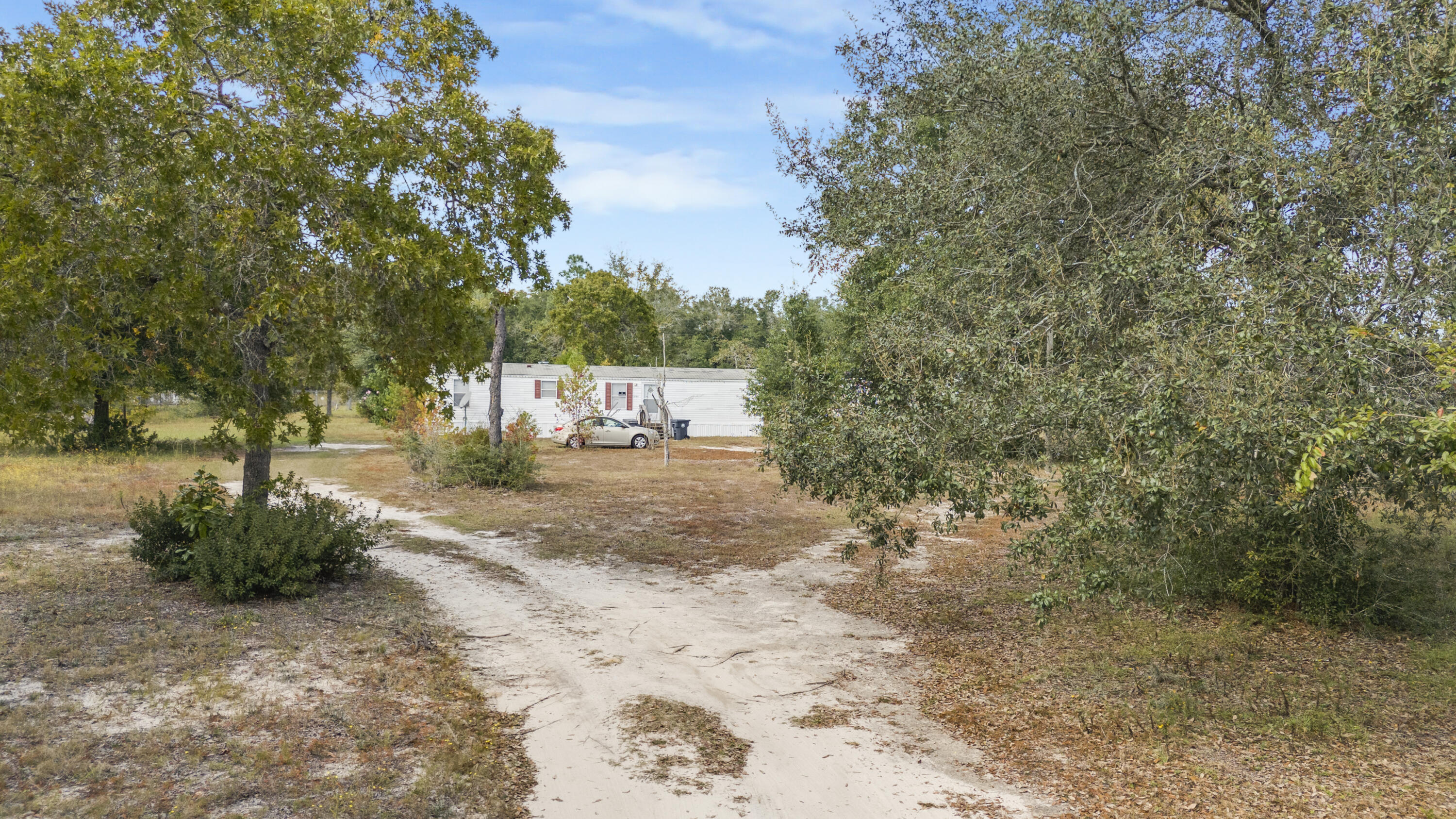 2.28-Acre Homestead or Income Opportunity - DeFuniak Springs, FLEmbrace the peaceful charm of North Florida living on this combined 2.28 acres of land, perfectly zoned General Agriculture and full of potential for a homestead, rental investment, or multi-family retreat.This offering includes two separate 1.14-acre parcels, being sold together:One parcel features a 3-bedroom, 1-bath mobile home currently tenant-occupied, generating a projected rental income of $1,100/month--an excellent opportunity for instant cash flow.The second parcel has water access and an old brick building in the back. 2.28-Acre Homestead or Income Opportunity - DeFuniak Springs, FL
Embrace the peaceful charm of North Florida living on this combined 2.28 acres of land, perfectly zoned General Agriculture and full of potential for a homestead, rental investment, or multi-family retreat.
This offering includes two separate 1.14-acre parcels, being sold together:
One parcel features a 3-bedroom, 1-bath mobile home currently tenant-occupied, generating a projected rental income of $1,100/month an excellent opportunity for instant cash flow.
The second parcel has water access and an old brick building in the back.
Both properties have utilities on site and plenty of open space for expansion, gardens, animals, or additional dwellings. The land is high and dry with beautiful natural surroundings and the freedom that comes with agricultural zoning.
Located just 35 minutes from the white-sand beaches, Eglin Air Force Base, and local shops and dining, you'll enjoy country living without sacrificing convenience.
