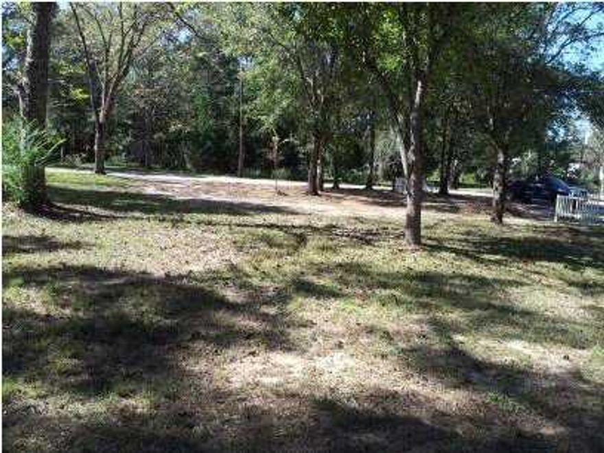 This lot is beautiful and in the old, historic section of De Funiak Springs! Level lot ready for a home!