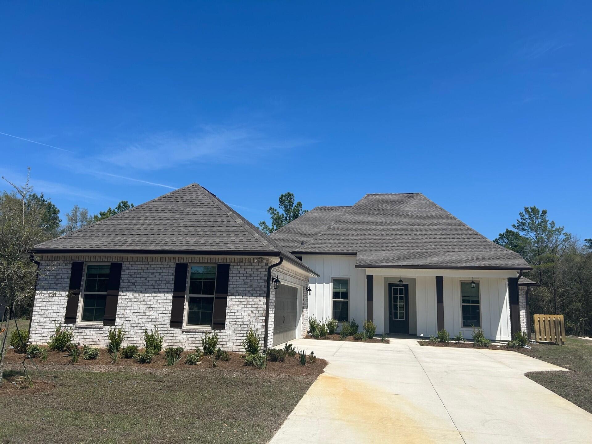 The RENOIR IV I in Bird Song at Hammock Bay community offers a 4 bedroom, 3 full bathroom, open design with flex space. Upgrades added (list attached). Features: double vanity, garden tub, separate custom tiled shower, and walk-in closet in master bath, kitchen island, walk-in pantry, boot bench and drop zone in mudroom, covered patio, crown molding, recessed lighting, smart connect WIFI thermostat, smoke/carbon monoxide detectors, landscaping package, architectural 30-year shingles, flood lights, and more!Energy Efficient Features: water heater, electric kitchen appliance package, vinyl low E windows, and more! Energy Star Partner.