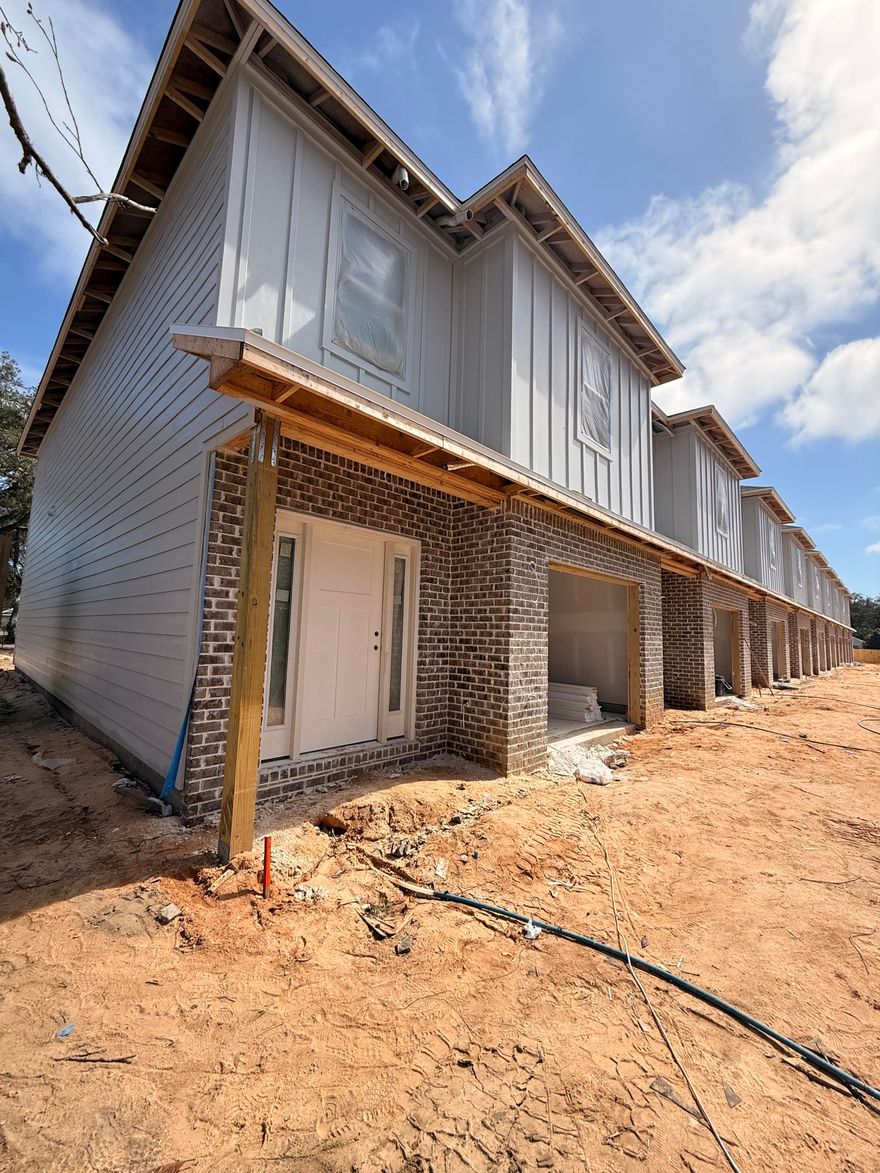 New Construction! END UNIT. $8,500 ANYWAY MONEY! 2-10 Builder Warranty, Termite Bond Renewed annually by HOA. Luxury Vinyl Plank throughout. Upstairs enjoys 4 bedrooms, 1 full guest bath, 1 on-suite bath for primary, & laundry room. Downstairs foyer leads to 1/2 bath, kitchen w/ breakfast peninsula & Stainless Appliances to include side by side refrigerator, Self-Cleaning Convection Stove, built-in microwave/range hood & dishwasher. Kitchen has quartz counters & tiled backsplash for modern vibes. Kitchen opens to the living & dining room. Elevated lighting & mirrors finish off the home. Back door leads to privately fenced backyard with a gate which opens to a water retention area brilliantly used as an unofficial dog park for owners. Apoxy Sealed Garage Flooring for a final touch.