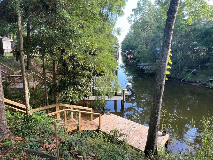 Rare opportunity to build in a charming coastal community in Santa Rosa beach. This beautiful homesite is shaded by stunning mature live oaks and located in a quiet neighborhood with NO HOA. The lot overlooks a canal and is just yards from the bay, offering breathtaking sunset views and easy water access. The brand new dock has been recently built, perfect for boating, kayaking or paddle boarding and exploring Choctawhatchee Bay. Enjoy peaceful coastal living just minutes from the white sandy beaches along the Gulf of Mexico. Nearby shops and restaurants. Ideal for building a primary residence, vacation home, or investment property.