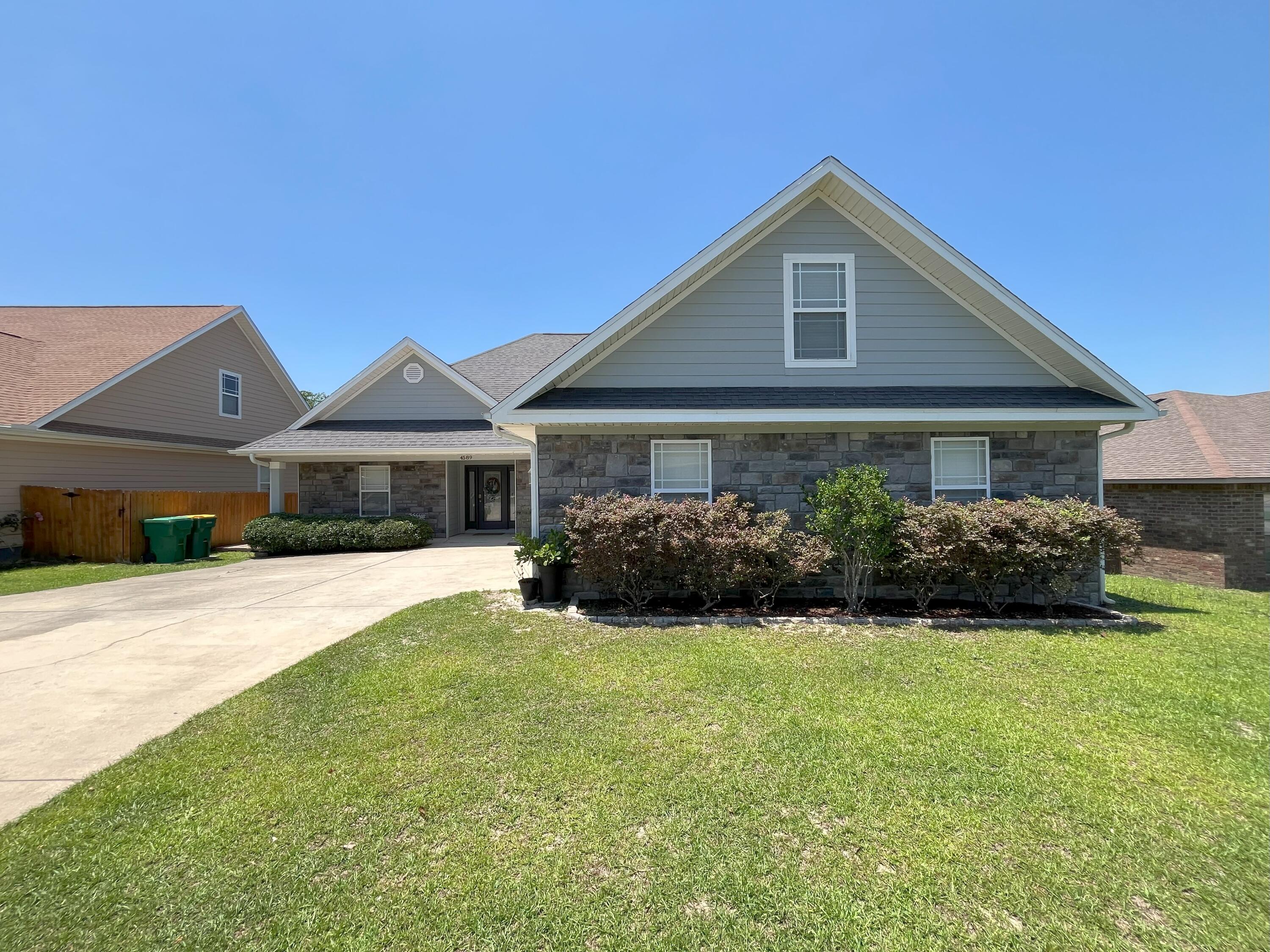Beautiful, must-see, 5 bedroom home in great south Crestview location. This home has some nice features to include a spacious, open, split bedroom floorplan, trayed ceilings, crown molding and beautiful LVP flooring throughout most of the house. The kitchen has stainless steel appliances, granite countertops, can and pendant lighting, breakfast bar and pantry. The large primary bedroom suite features double vanities, separate tub and shower and large walk-in closet. Upstairs can be a 5th bedroom or a nice size playroom, office or bonus space includes a half bath. The garage floor has been sealed and there is plenty of room in the garage for 2 cars and additional space for work-out equipment, toys or storage.