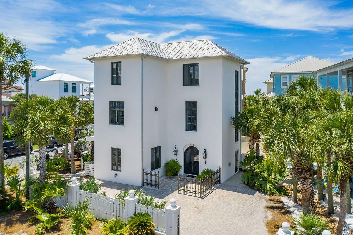 Endless memories and enchanting views abound from this ideally located three story beach home nestled along one of the most walkable stretches of Seagrove Beach. Impeccably maintained, this three-story property offers a crisp contemporary coastal design, an open and air floorplan, and spacious outdoor spaces, sure to delight discerning property buyers. Sitting three tiers off the sugar white sand beaches south of 30A, convenience is paramount with an elevator transporting throughout all three levels, with three bedrooms on the main level and a reverse concept living-kitchen-dining space on the second. The top floor is an encapsulating owner's retreat offering a private living space as well as an oversized ensuite for the ultimate in privacy and relaxation.