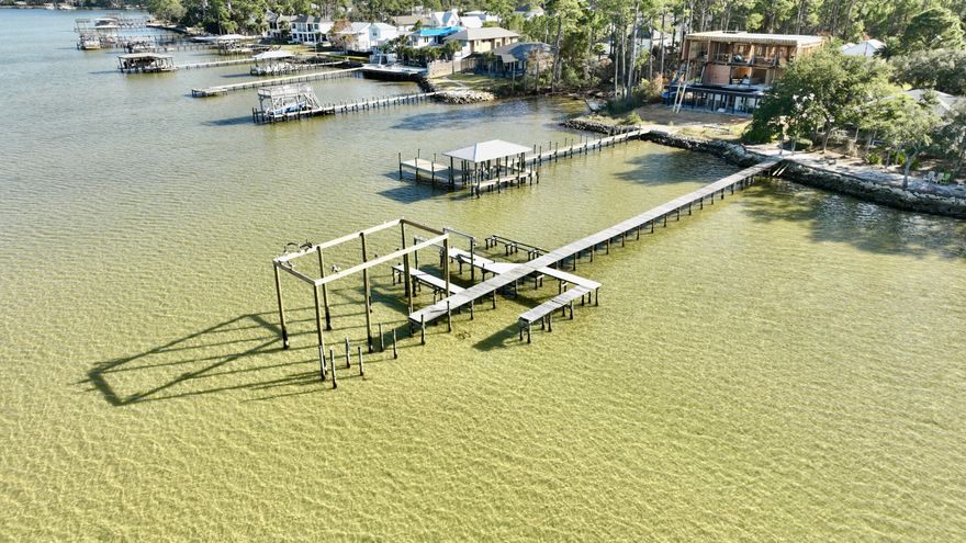 SELLER IS EXTREMELY MOTIVATED SEND ALL OFFERS. This furnished home is move-in ready and short term rentals are allowed. Stunning Bayview Home with Private Boat Slip & Expansive Water Views. Located directly across from the serene bay, this exceptional 5-bedroom, 3-bathroom home offers a perfect blend of comfort, style, and convenience. Enjoy panoramic water views from the balconies, while still benefiting from easy access to the bay with your own private boat slip and lift featuring electric at dock. Key Features:

-5 Bedrooms + Den - Spacious, light-filled bedrooms provide plenty of room for family and guests, while the den offers a versatile space for work or relaxation.
-3 Full Bathrooms - Thoughtfully designed bathrooms with high-end finishes create a luxurious and functional space.
-Indoor Sauna - Relax and unwind in your own private sauna, adding a spa-like touch to your everyday routine.
-Private Boat Slip with Electricity - Enjoy the convenience of a private boat slip just steps away from your home, perfect for boating enthusiasts, with electricity available for your convenience.
-Custom Outdoor Garage/Storage - A unique outdoor garage that doubles as additional storage space, offering versatility for vehicles, boats, or equipment.
-Balconies with Bay Views - Multiple balconies allow you to enjoy breathtaking views of the bay and surrounding landscape, whether it's sunrise or sunset.


While this home is not directly on the water, the unobstructed views of the bay make it feel like you're right there. The interior is thoughtfully designed with an open-concept living area that flows seamlessly into outdoor spaces, perfect for entertaining or simply enjoying the peaceful coastal lifestyle.

Situated in a highly desirable area, this home offers the best of both worldstranquility and stunning water views, combined with easy access to the bay. Whether you're enjoying a peaceful evening on your balcony or embarking on your next boating adventure, this property is an oasis of luxury.