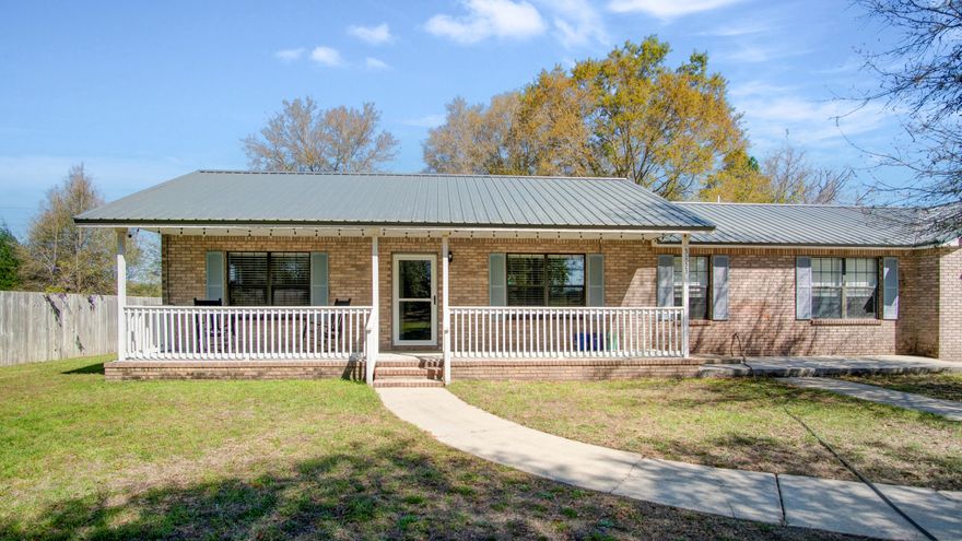 This gem can be found at the road's end tucked away from the city lights, yet minutes away from shopping, dining, and an amazing park, with an easy commute to local military bases and the beach.  This home features granite countertops with a breakfast bar and tiled backsplash, laminate plank flooring, and a large front and screened back porch with a fenced back yard.  The HVAC was replaced in 2020 and the metal roof was installed in late 2021.