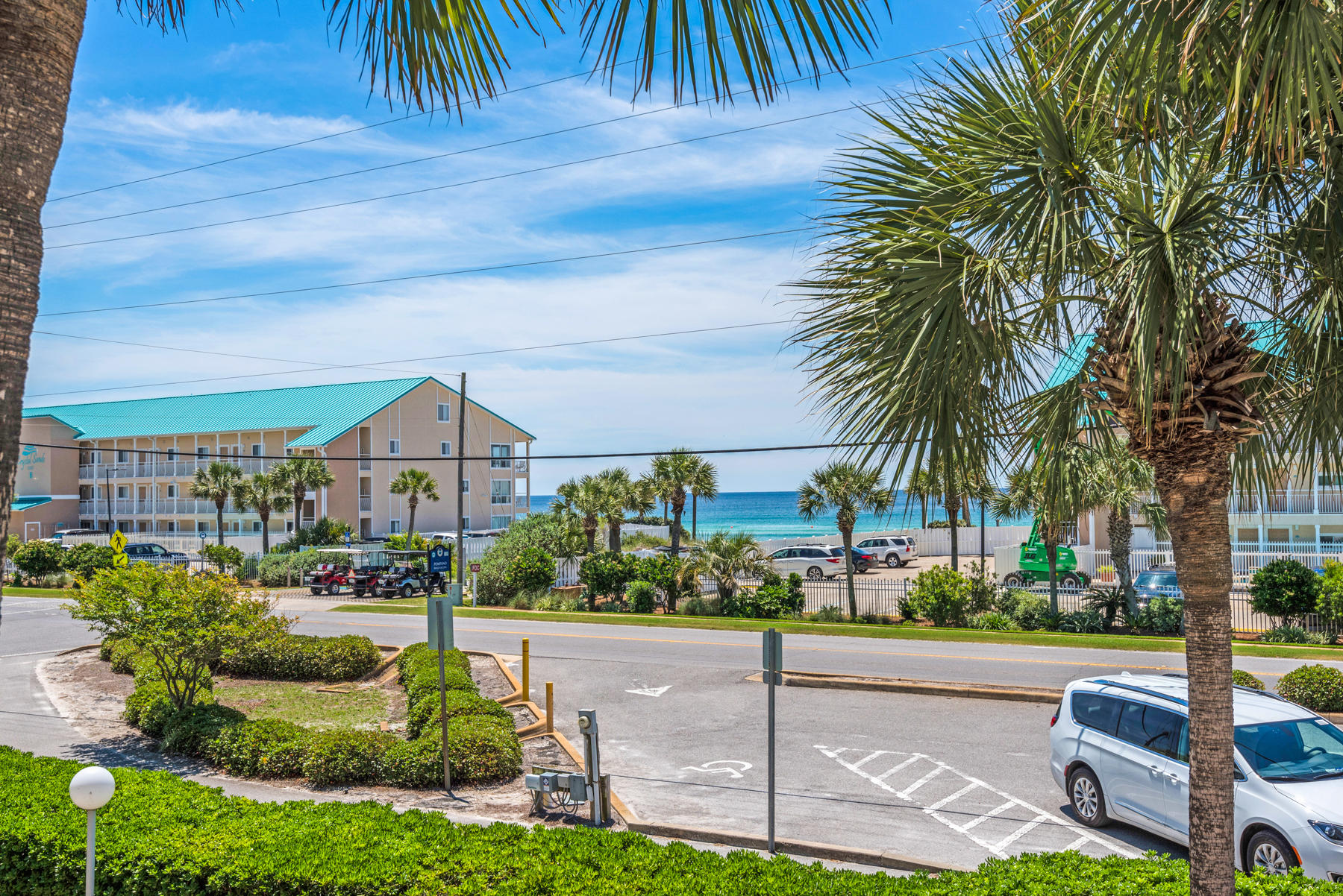Gulf View from this cozy 1 bedroom condo in Grand Caribbean West. Great vacation rental or second home directly across the street from the Gulf. Living and Dining open to the balcony with vinyl plank flooring, granite counter tops in kitchen with breakfast bar, granite counter in bath and bunks in the hall with washer/dryer. Don't miss this opportunity to own by the beach.