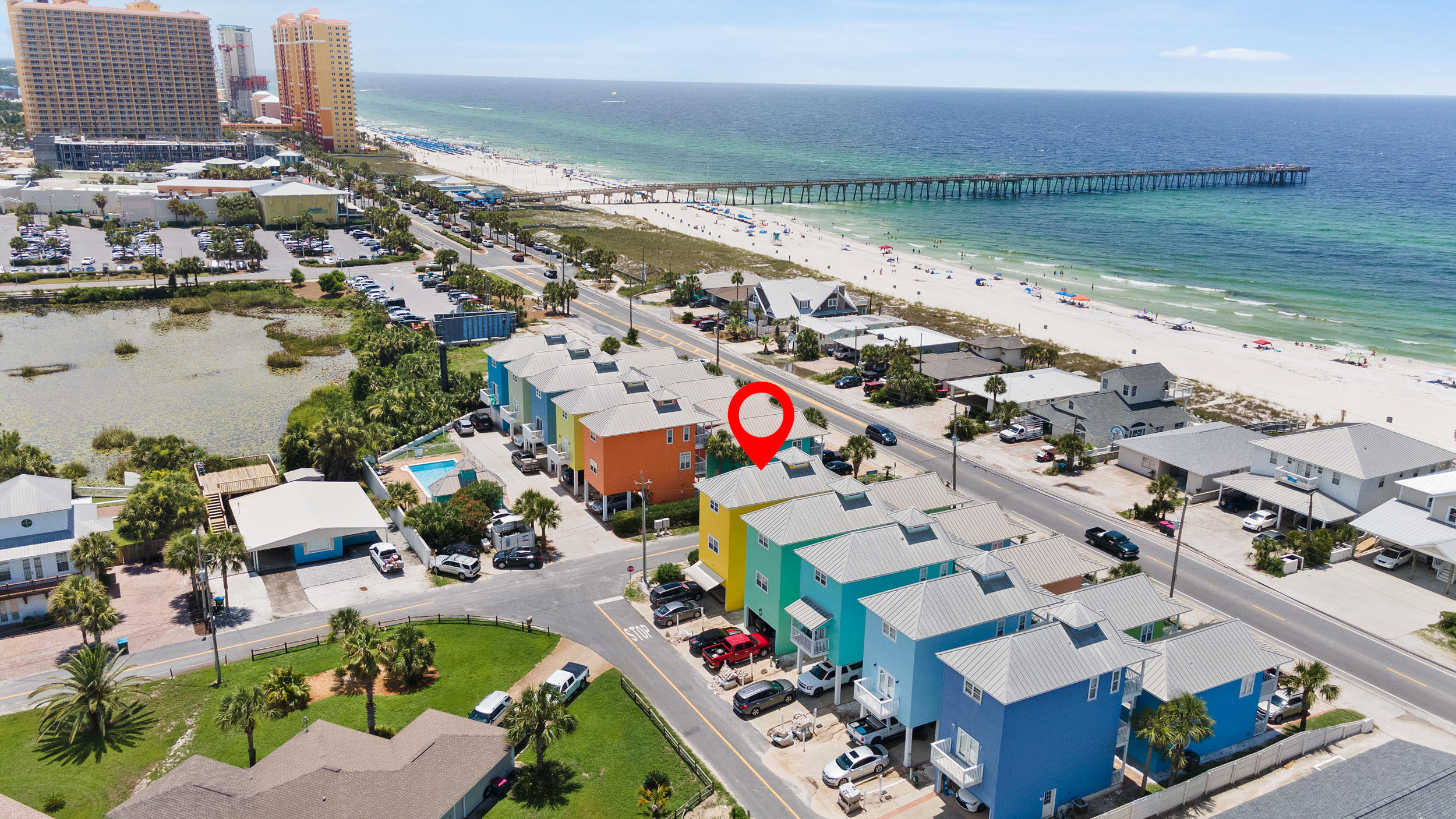 BEAUTIFULLY MAINTAINED and FULLY FURNISHED townhome steps away from Pier Park and the dog beach!!! Incredible rental income potential and STR allowed. Vaulted ceiling, freshly updated with a modern color palate, thoughtful furnishings. All of this and a spectacular VIEW!!! Many upgrades and unique features you simply MUST see! This will NOT last long! Professional photos will be added soon. BUYER TO VERIFY ALL INFORMATION DEEMED IMPORTANT.