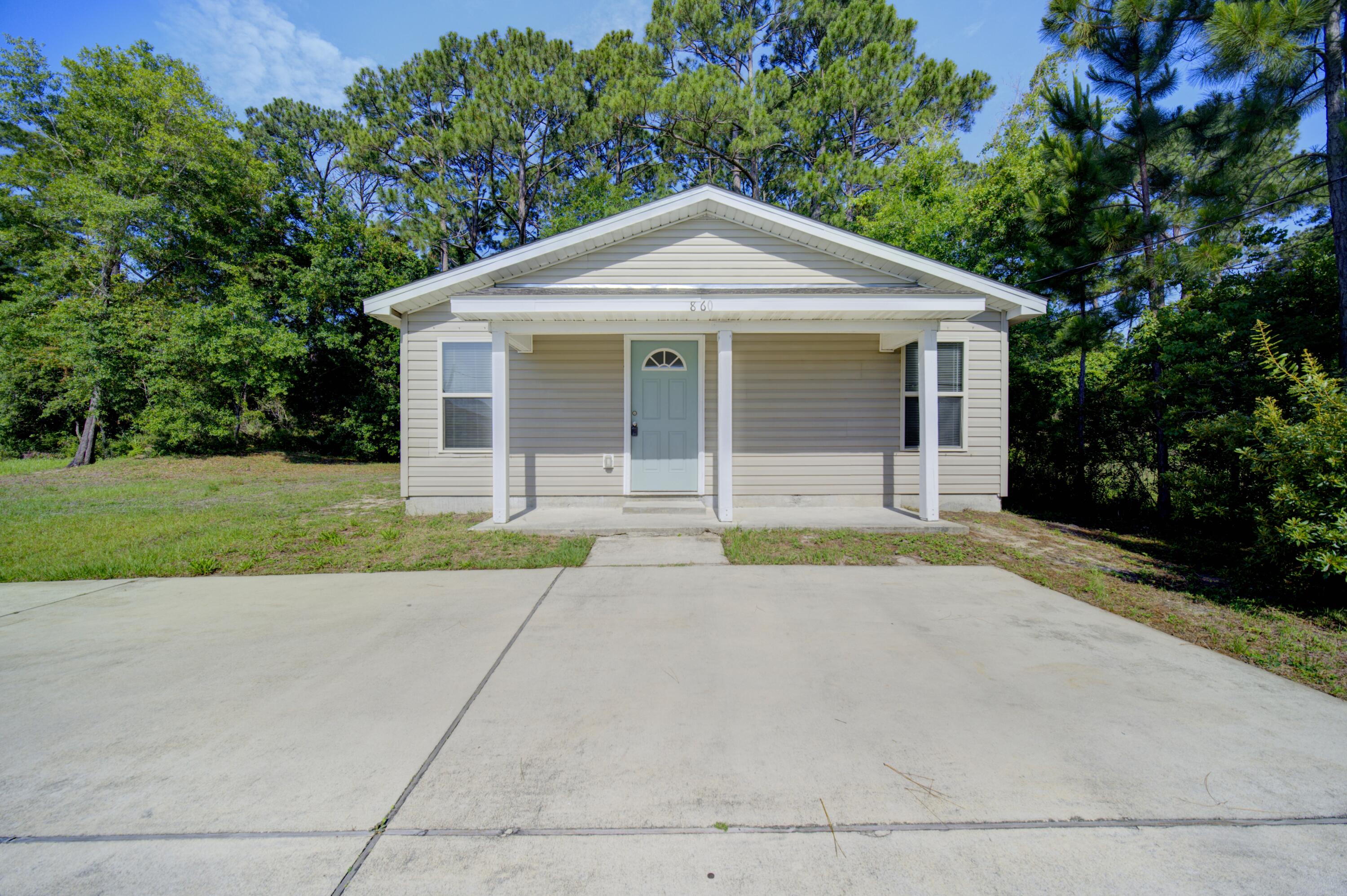 Great Starter Home or rental investment located less than 2 miles to Navarre beach. Offering 2 Bedrooms, 2 Baths with an open Floor plan. Seller plans to put new carpet in front bedroom and replace the flooring in living room and kitchen. Kitchen has granite countertops. Built in 2018. Current parcel to be split prior to closing. Sale is for 8460 Promenade Ct Only. Parcel ID and Legal description to be updated.
