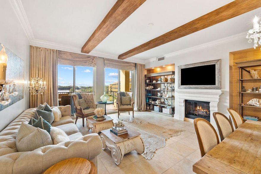 Boasting tasteful decor by Lovelace Interiors, this stunning top-floor condo is a true Sanctuary by the Sea. It comes with its own private poolside cabana, which is far from the ordinary. This air-conditioned space has a living room with bar and a full bathroom for the ultimate lifestyle experience. The entire condo was meticulously renovated with no expense spared. The result is a breathtaking home that displays careful attention to every detail. Ten-foot beamed ceilings, glittering chandeliers, a feature fireplace and custom furnishings allow you to relax and enjoy the views from a place of comfort and luxury. Step inside this haven of luxury and admire the lake and gulf views from the living room, dining area, kitchen and master bedroom as well as from the balcony. Carefully curated furnishings and neutral decor echo the coastal location along with beach-inspired accents. The chef's kitchen is an epicurean masterpiece with bespoke birch-wood cabinetry, Viking appliances and a double range. Hand-laid crushed seashells adorn the ceiling and backsplash. Serve sunset cocktails and perfectly chilled wine to guests at the wet bar when entertaining. Four gorgeous ensuite bedrooms include a Versailles-worthy master with fabulous mirrored closets and direct balcony access. Imagine taking long bubbly soaks in the deep copper tub with gulf views, or enjoying a temperature-controlled steam shower beneath the pearlized ceiling. Sea glass tiles enhance the backsplash on the double vanity. This beyond-ordinary condo is one of 82 luxury homes located on 23 acres of prime property. As well as 65 feet of gulf frontage, it overlooks Redfish Lake, a rare coastal dune lake. Three beautiful pools offer the ultimate outdoor experience with private cabanas, waterfalls, fountains and hot tubs. Socialize with your peers at the gulf-front owners' lounge or around the BBQs and fire pit. Other outstanding amenities include a state-of-the-art fitness center, theater room, virtual golf simulator, high-tech video arcade and owners' storage. This landscaped paradise is within easy reach of top-rated golf courses, shopping, dining and endless outdoor recreation at Point Washington State Forest and Grayton Beach State Park nearby.