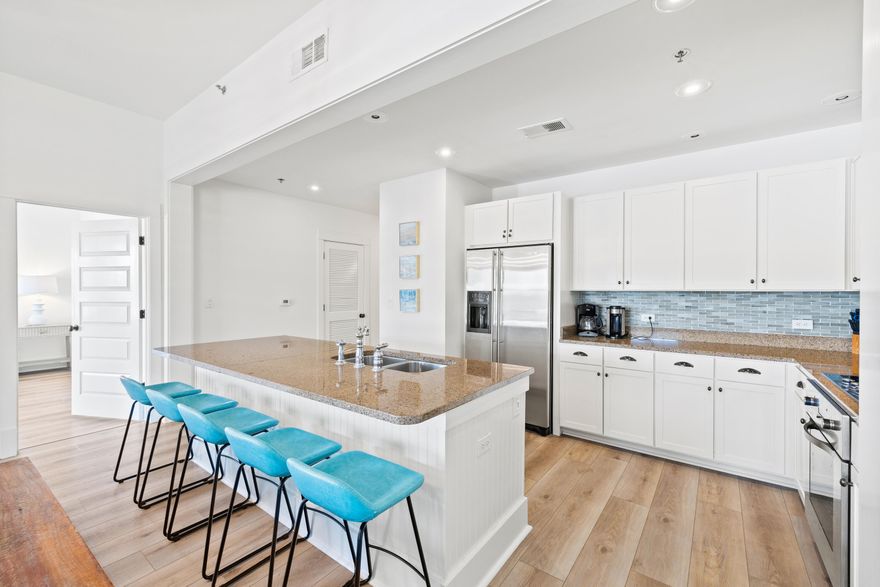 Rare opportunity to own a top floor corner unit in the highly sought-after Redfish Village! Freshly painted, this 3 bedroom 3 bathroom condo offers an open layout highlighted by newly laid waterproof LVP flooring. The owner has spared no expense with recent updates including a renovated master bathroom, new kitchen backsplash, contemporary light fixtures and newer furnishings complimented with smart TV's in each room. Once outside on the oversized balcony, you will immediately realize the privacy this unit provides with its corner position offering sunrise views over Big Redfish Dune Lake. A proven income earner, unit M2-414 is being offered fully furnished and turnkey with rental income projections exceeding $50,000 annually. Situated in the heart of Blue Mountain Beach, Redfish Village