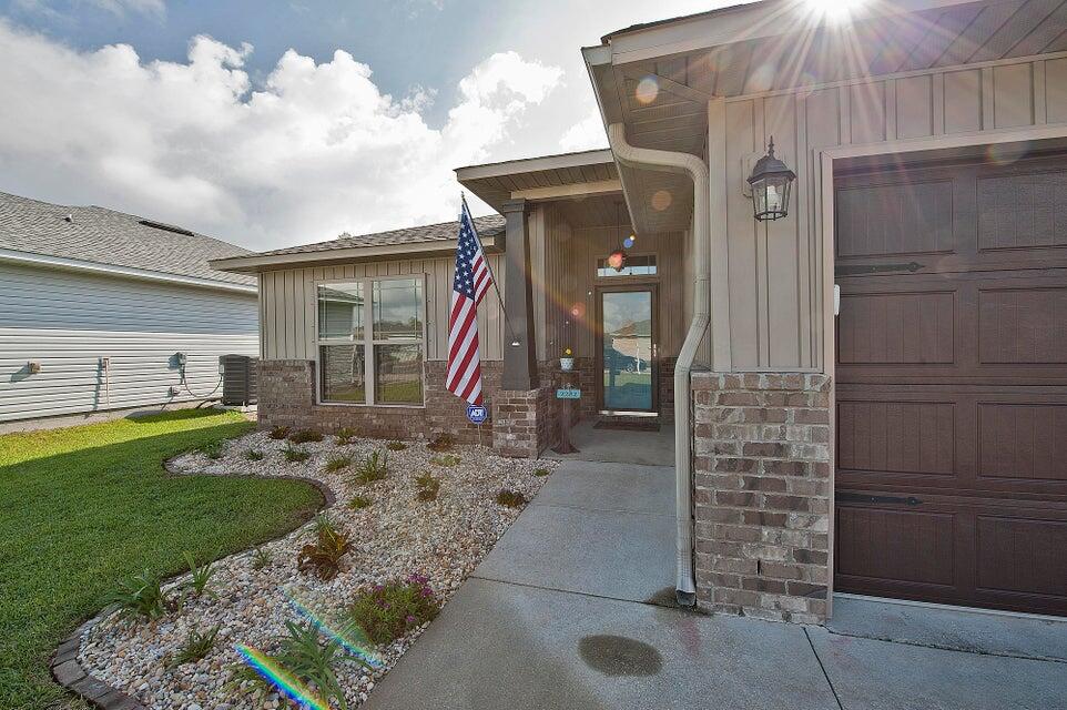Welcome to this beautiful 3-bedroom, 2-bathroom home nestled in the heart of Navarre, Florida! Perfectly situated just minutes from the pristine white sandy beaches of the Gulf Coast and conveniently close to Hurlburt Field Air Force Base, this home offers both comfort and convenience.Step inside to find a spacious open-concept living area with plenty of natural light, perfect for entertaining. The kitchen features modern appliances, ample cabinet space.The primary suite boasts a private bathroom with a double vanity, soaking tub, and walk-in shower, creating a relaxing retreat. Two additional bedrooms provide plenty of space for family, guests, or a home office.
