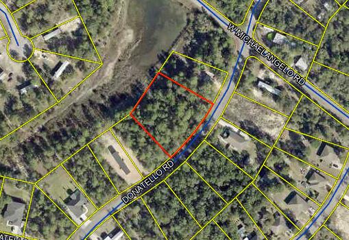 Great Location with No HOA Fees! Ideal for building your dream home or setting up a mobile home. This vacant wooded double lot offers convenient access to major highways such as I-10, 331, and 90. It is located just miles from hardware and grocery stores, schools, downtown, and the captivating historic Defuniak Lake. you'll be thrilled to discover the abundance of outdoor activities nearby, including fishing, golfing, national parks, and the beautiful beaches of the Emerald Coast. There are NO utilities in place. POWER: Available in the area. WATER: It would be public water. SEWER: It would be Septic.