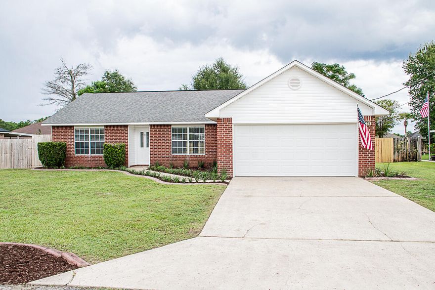 Move in ready home on fenced level lot in South Crestview. This open concept, split floor plan has been remodeled with new paint, new LVP flooring, new carpet in bedrooms, new bathroom fixtures, new granite countertops, new light fixtures, new ceiling fans, new garage door, new vinyl siding, and more! The kitchen is a chef's dream, complete with a center island, plenty of cabinet space for all your kitchen gadgets as well as a pantry. The appliances are less than a year old.  Master bedroom is very large and the master bathroom has a double vanity with new granite vanity tops and a garden tub. Master closet is located in the master bathroom and is outfitted with custom shelving. Roof was replaced March 2015 and a new water heater was installed April 2016. The French doors in the living room open up to a covered back patio that is perfect for outdoor entertaining.