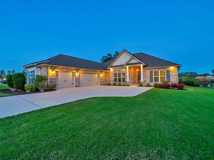 Welcome to The Richmond Two, an exquisite poolside home in the heart of Hammock Bay, a vibrant community known for its spectacular events, trails, pools, playgrounds, and more. This beautifully crafted Truland home sits on a private half-acre wooded lot with serene pond views, perfect for sunrises and sunsets. Inside, enjoy upgraded hardwood floors, an open floor plan, a gas fireplace, quartz countertops, frameless showers, Rinnai tankless water heater, and a Flex/Bonus Room with vaulted ceilings and tons of light. With 4 bedrooms, 3 full baths, enclosed 7-foot pool, outdoor shower, and a 3-car garage, this home offers ample space and storage. Don't miss this opportunity to own one of the best waterfront views in Hammock Bay