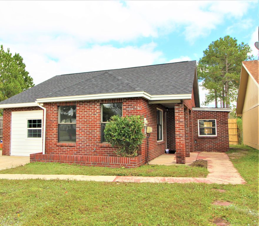 WOW!! BETTER THAN NEW! Enter through a custom leaded glass front door to find a spacious living room with beautiful laminate plank flooring, designer ceiling fan and lots of windows for natural lighting. Dining area is open to the living area making entertaining a breeze. Kitchen has custom cabinets with soft close drawers, granite counter space, tiled back splash, designer fixtures and top of the line stainless steel appliances. Master bedroom has sliding glass doors that lead out to a private large open patio. Master bath has double custom cabinets, granite counter space, double vanities and designer lighting and fixtures. Additional bedroom is large enough that you could easily use it as separate family room. Inside laundry room. New roof, New HVAC system, Water heater is