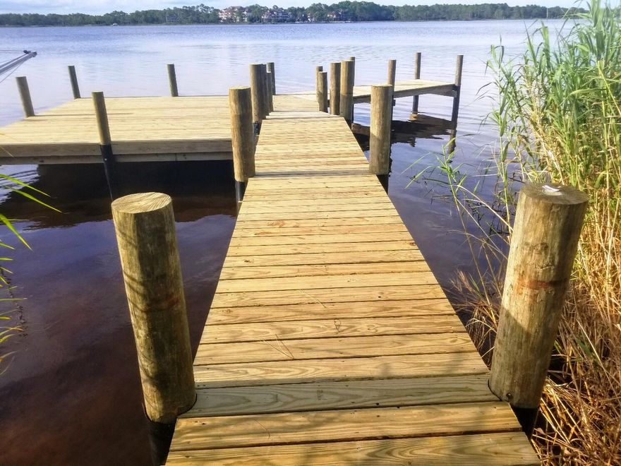 New construction lakefront living at Miller's Landing with direct access to Lake Powell, plus shopping, dining and beautiful beaches all nearby. Gorgeous new construction townhomes will be ready to move in soon with target completion for construction in early April. Miller's Landing is a beautiful, coastal community on Lake Powell minutes from 30A and at a fraction of the price. Enjoy the relaxed lakeside lifestyle of boating, kayaking, fishing or paddle boarding on the lake just steps from your front door.  

This premier community features a lakefront pool and a day dock on Lake Powell. The gentle slope adjacent to the day dock is perfect to directly launch your kayak or paddle board easily from the lake shore. For larger watercraft, the public boat ramp is located just one block away. This spacious 3 bedroom townhome offers a one car garage, 9 foot ceilings, quartz countertops, luxury finishes, LVP flooring thru-out and generous balconies.  Main living, master bedroom/bath and half bath are located upstairs, and 2 additional bedrooms and an additional bathroom are located downstairs.  

Full price initial offers are being accepted for review by the builder from now until end-of-day on January 23rd, 2022. All offers will be evaluated on Monday, January 24, 2022. In the even that there are multiple offers on a townhome, a best and final process will be initiated. Offers must use builder forms and follow builder instructions for offer submission.  See additional documents or contact listing agent for more information.  

This community has a 30-day minimum rental restriction.  A capital contribution of 2 months of HOA fees ($620 total) is required at closing.  All information and sizes are approximate, and buyer should verify if important.