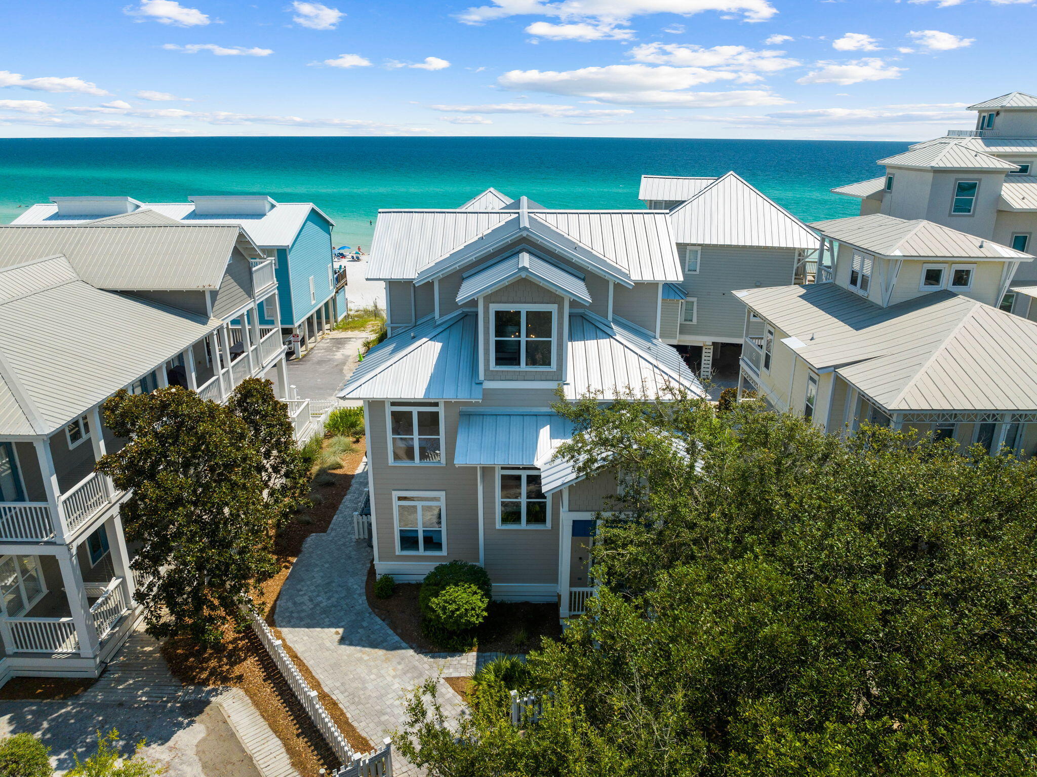 Prominently positioned to embrace the stunning views of the turquoise hued waters throughout the newly remodeled floorplan spanning three floors and over 3,000 square feet, 67 S Ryan Street stands as a timeless masterpiece of elegance and coastal luxury with a modern flair. A unique collaboration between idMI Designs and Ray Jackson Construction, the expertly curated floor plan showcases soaring ceilings, ample outdoor living space, and high-end finishes throughout. Designed for entertaining, the culinary kitchen features custom cabinetry, an extended island, six-burner gas range, Sub Zero refrigeration, and a professional grade appliance package.